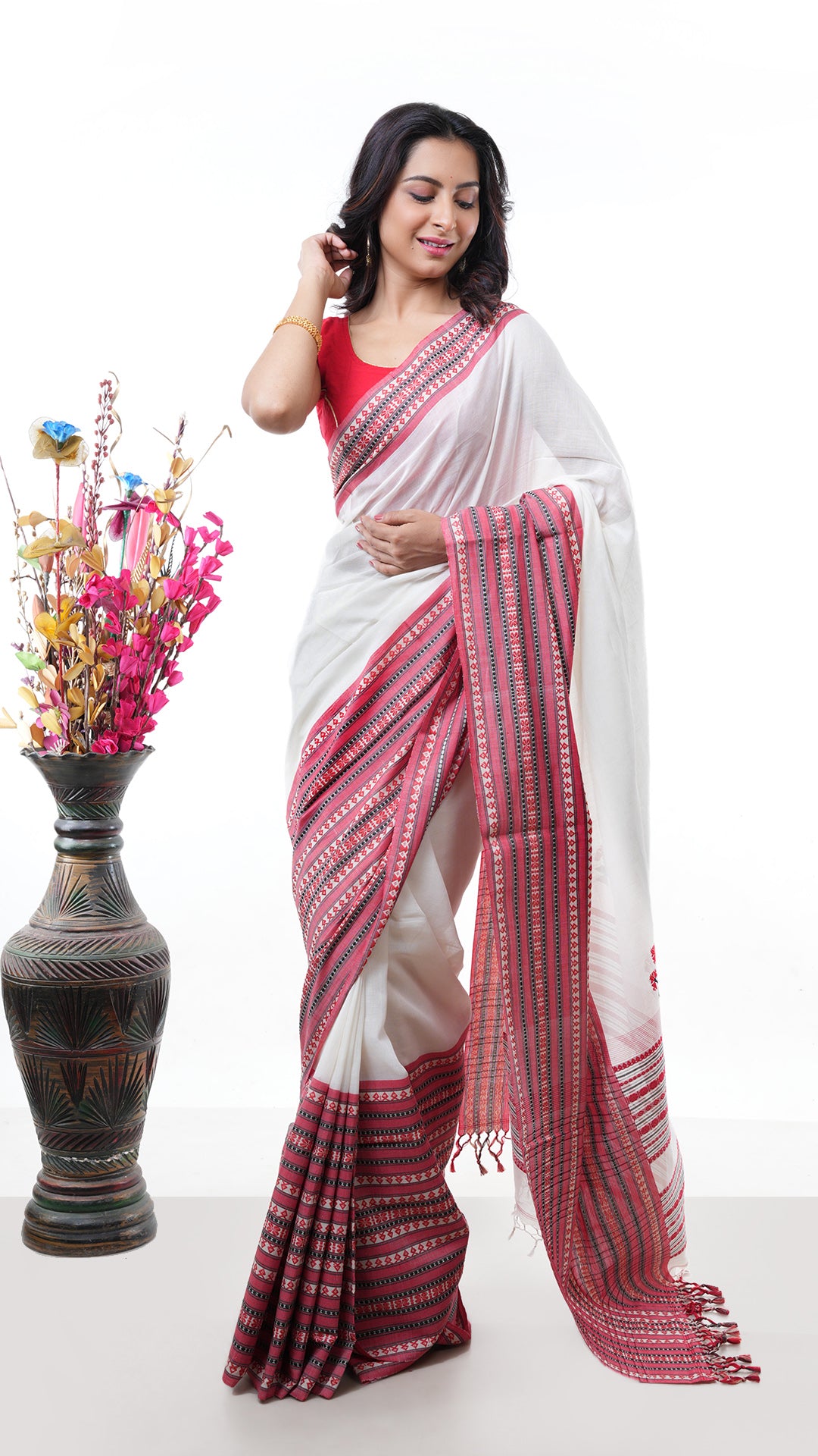 An off white broad border saree