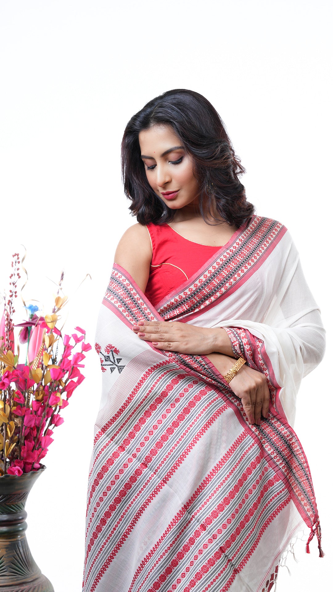 An off white broad border saree