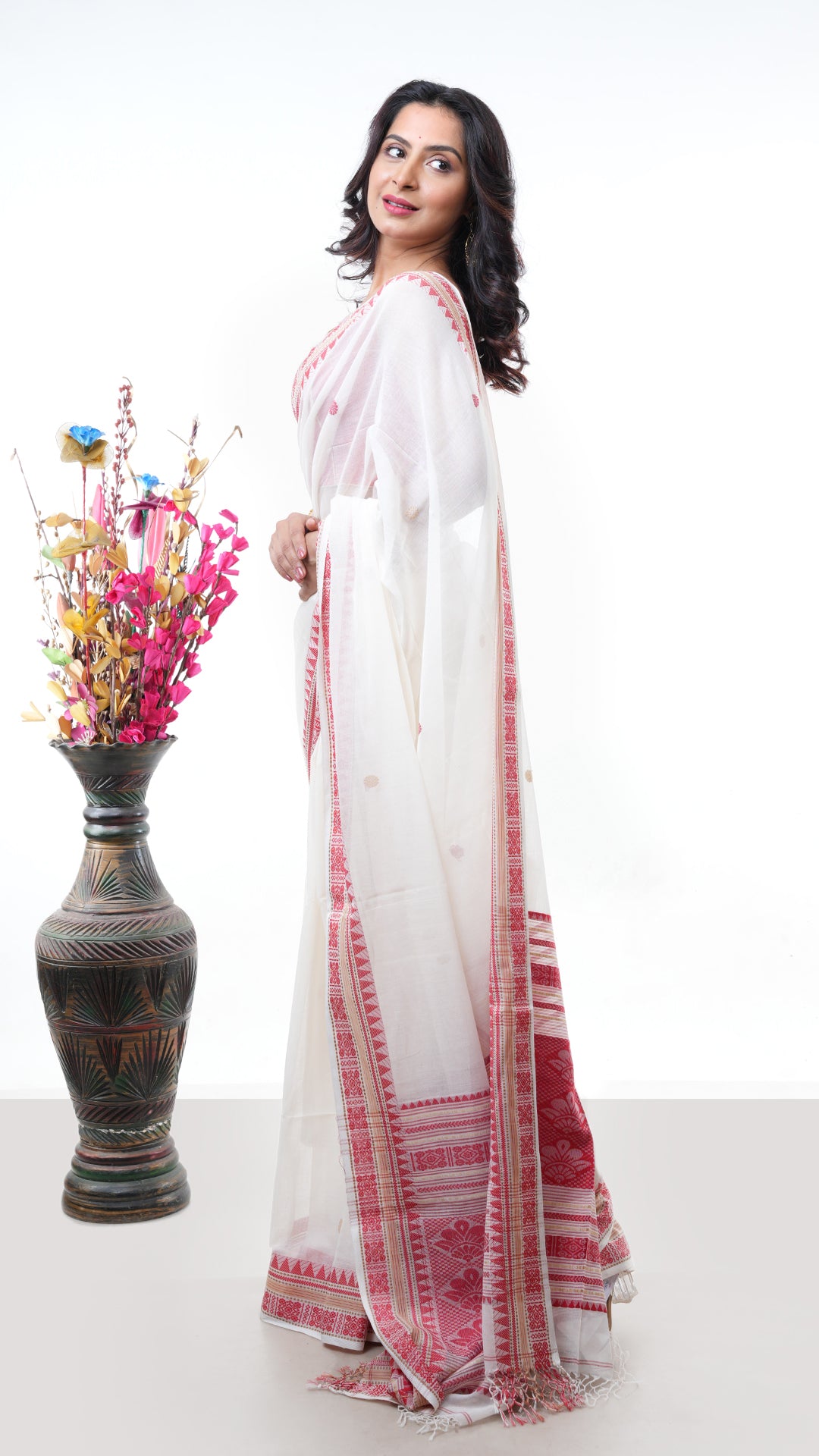 An off white red cotton saree