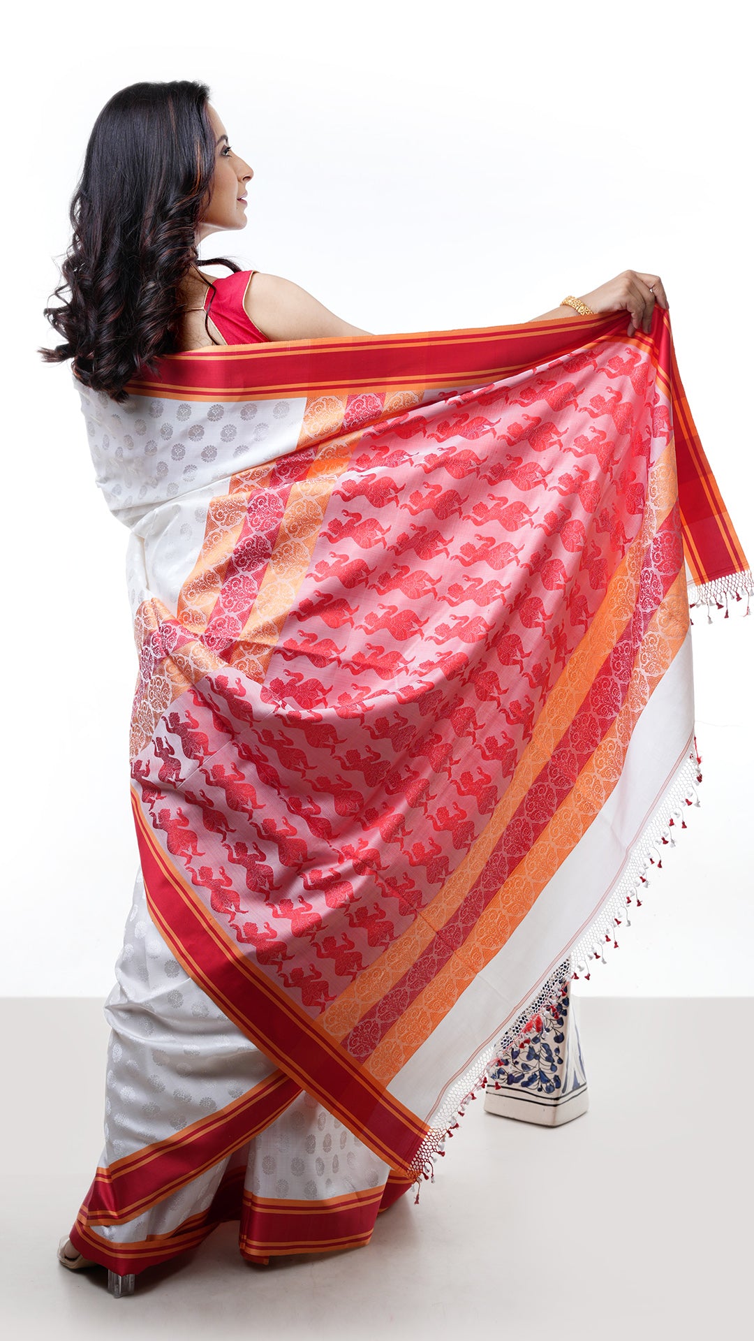 A white and red silk saree