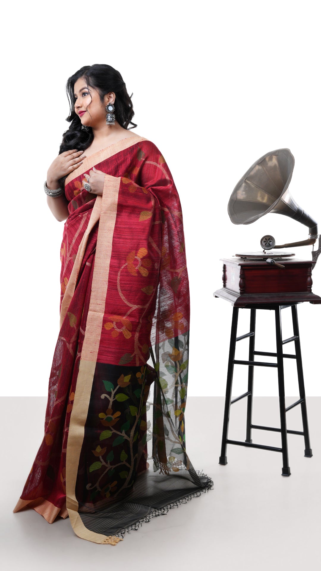 A blackish red raw silk saree