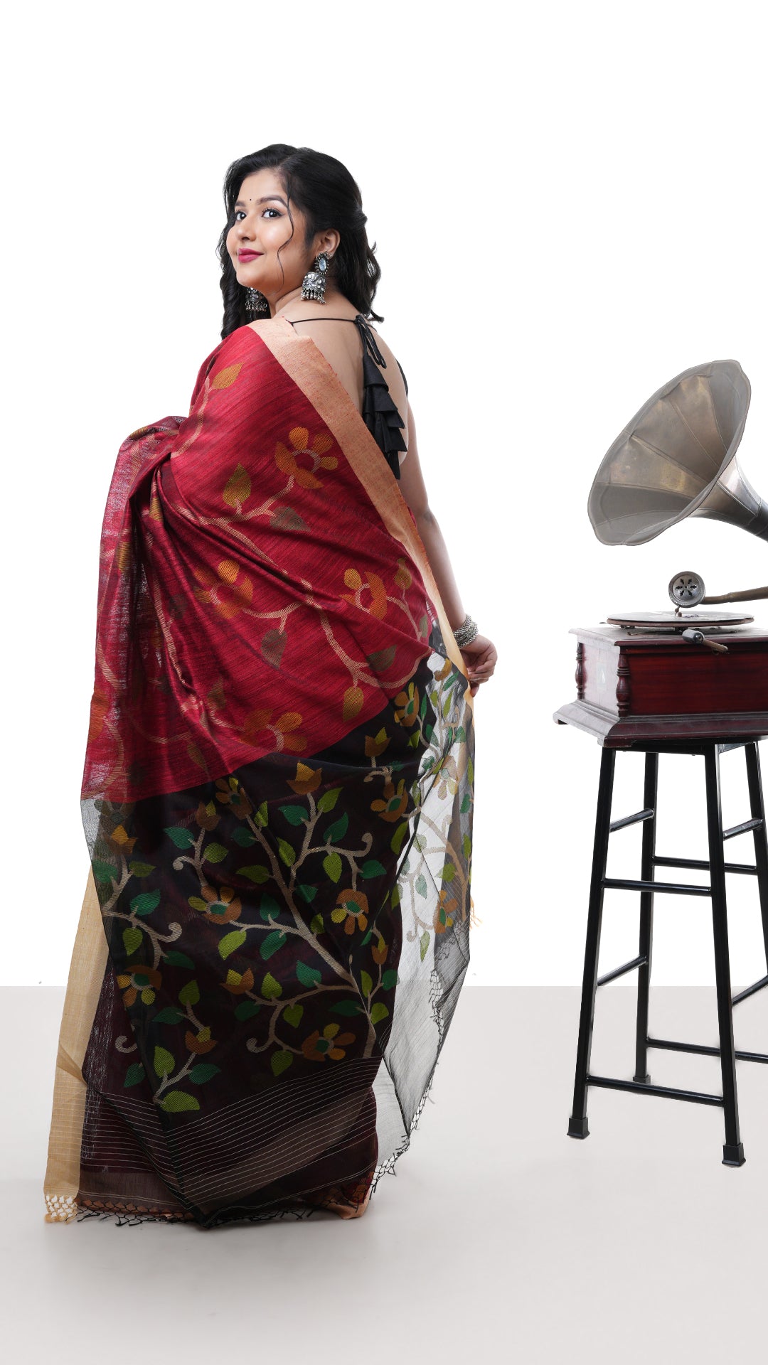 A blackish red raw silk saree