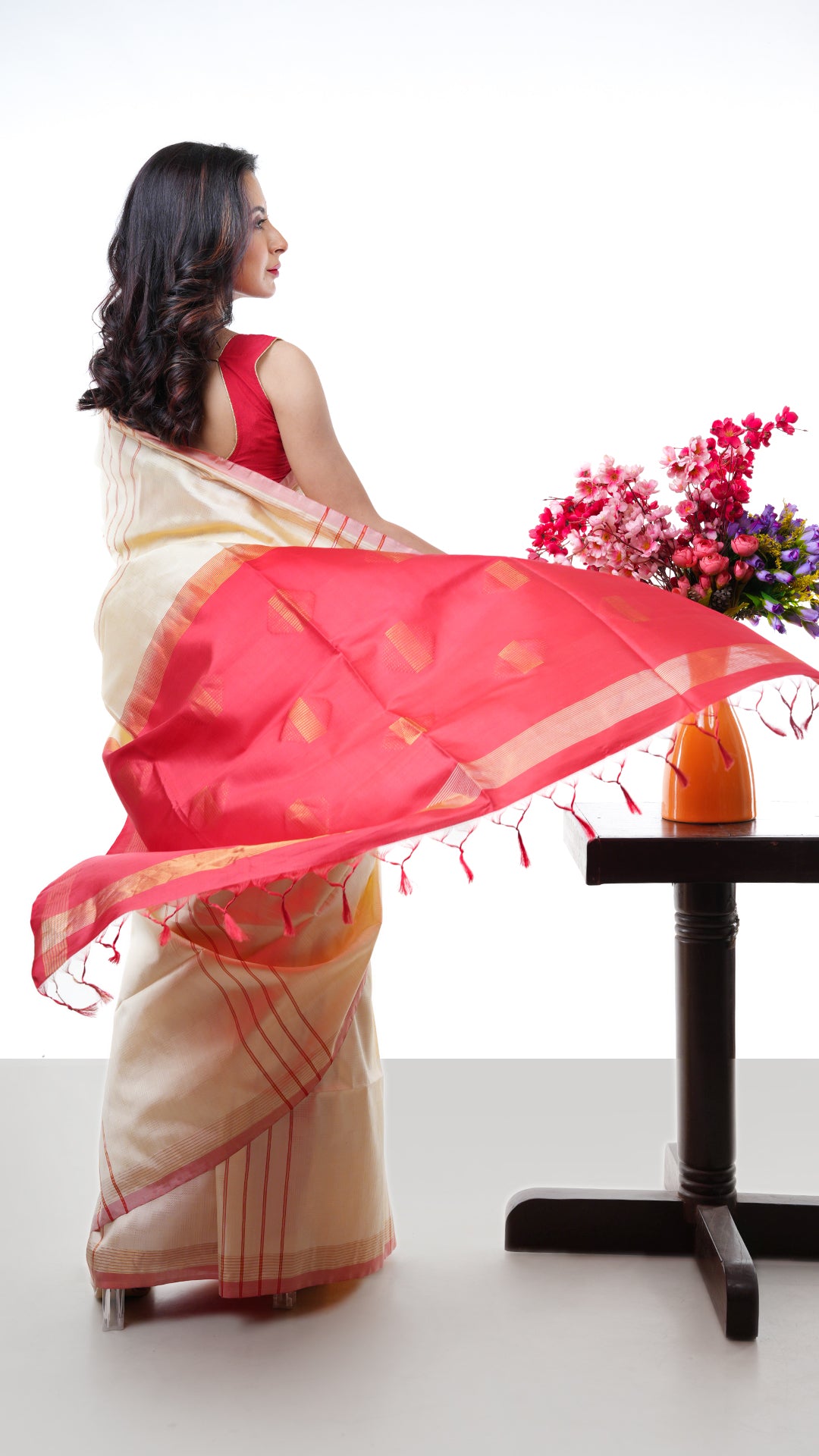 An off white red silk saree