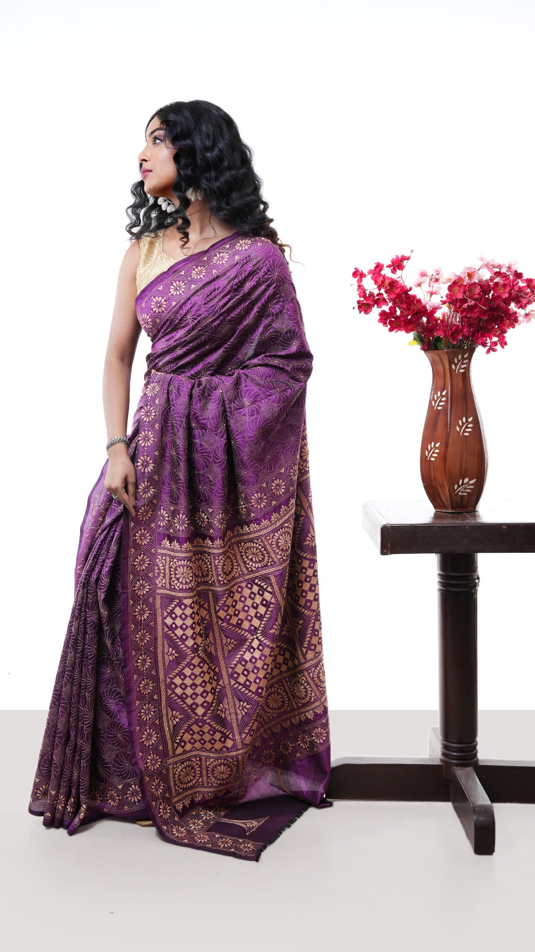 A magenta silk kantha saree