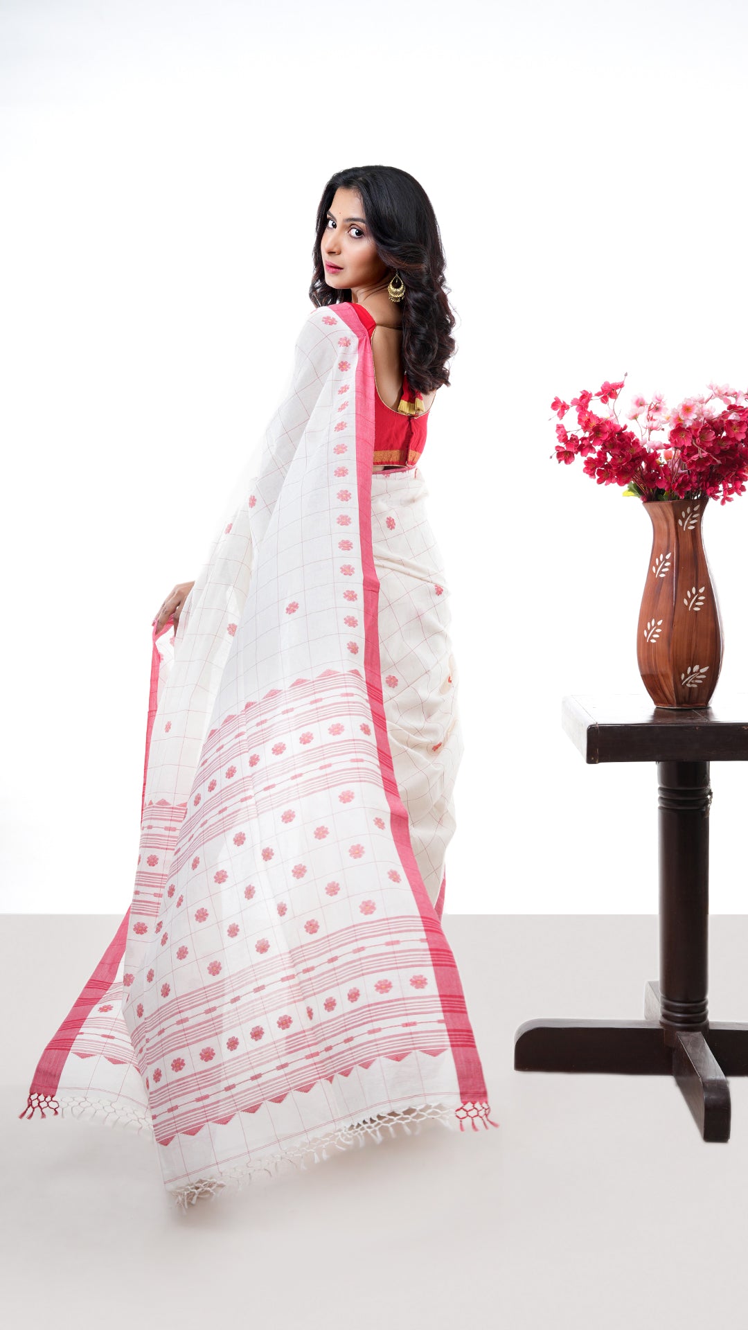 An off white red cotton saree
