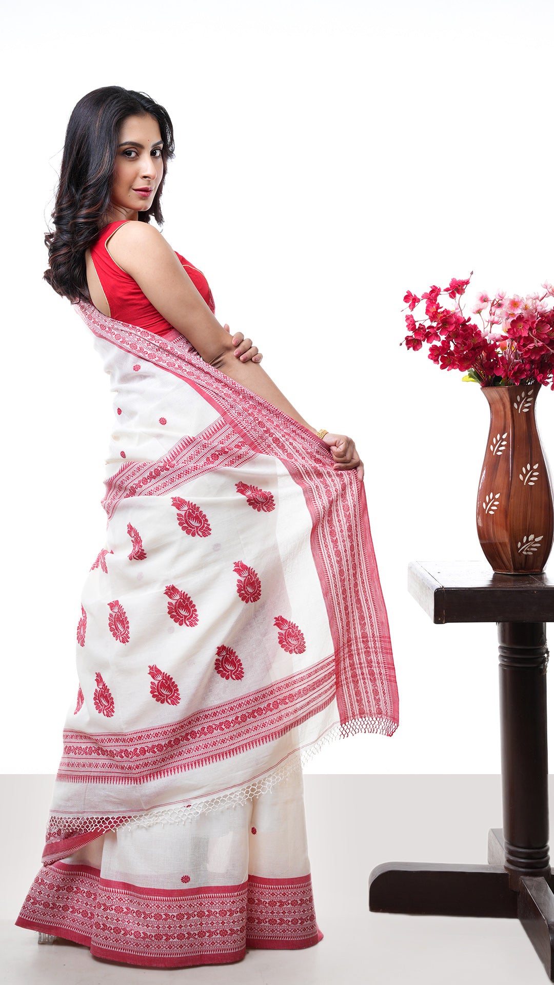 An off white red cotton saree