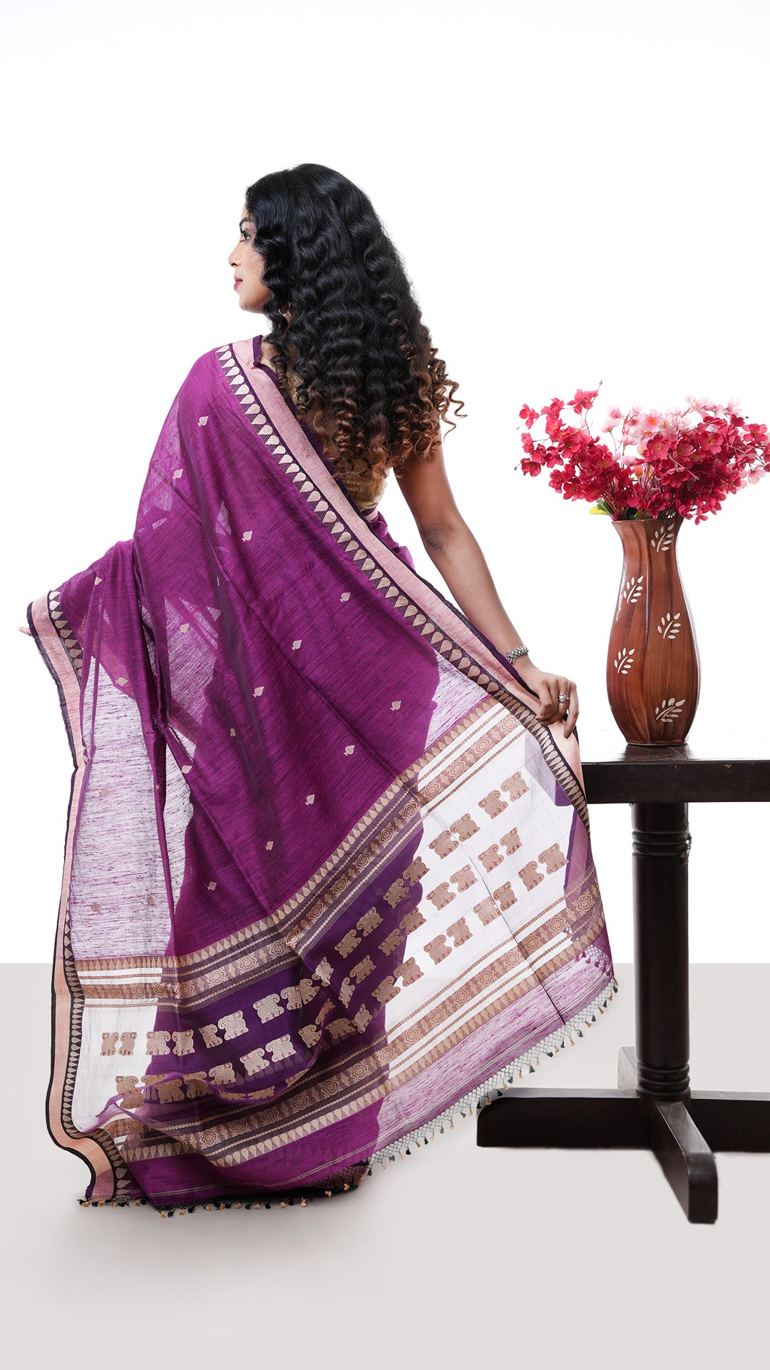 A purple raw silk saree