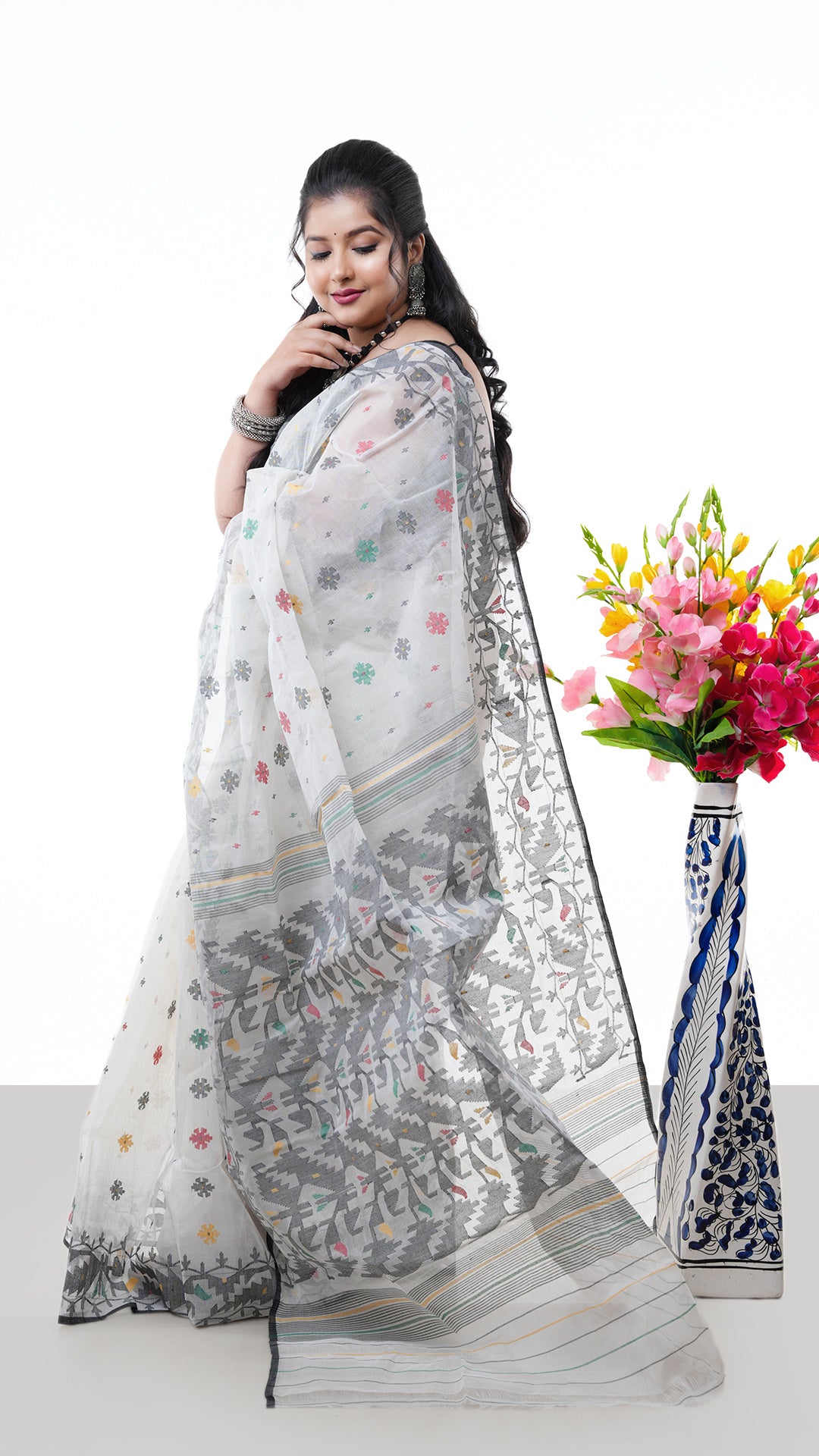 A multi coloured jamdani saree