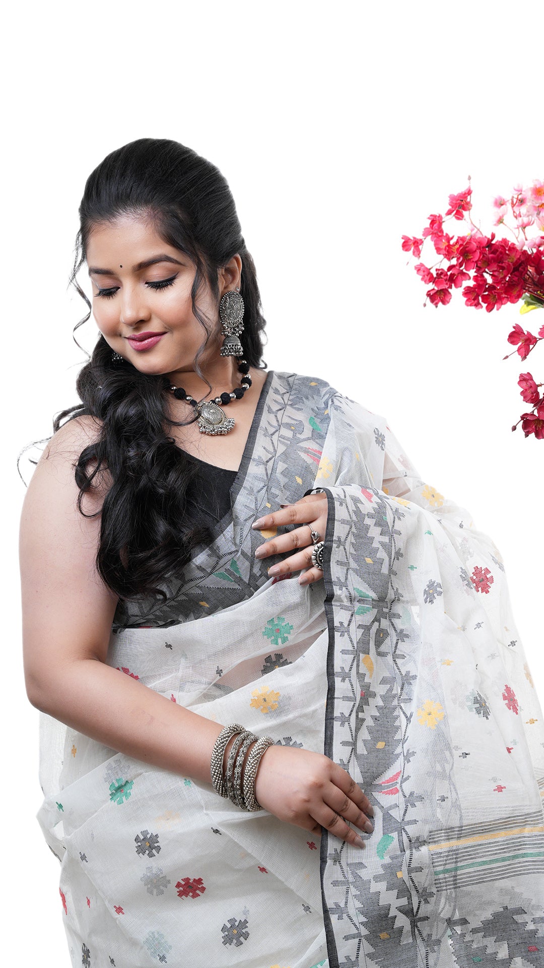 A multi coloured jamdani saree