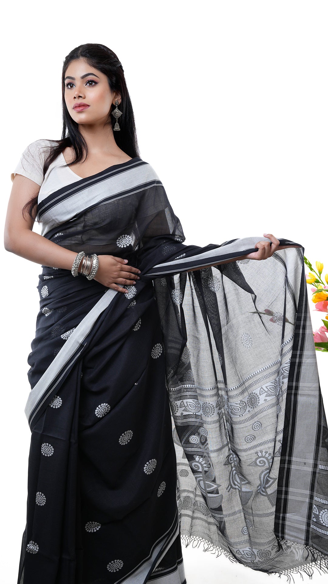 A black saree with white weave
