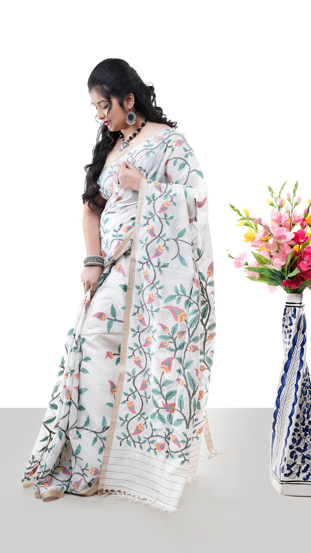 A multi coloured off white saree