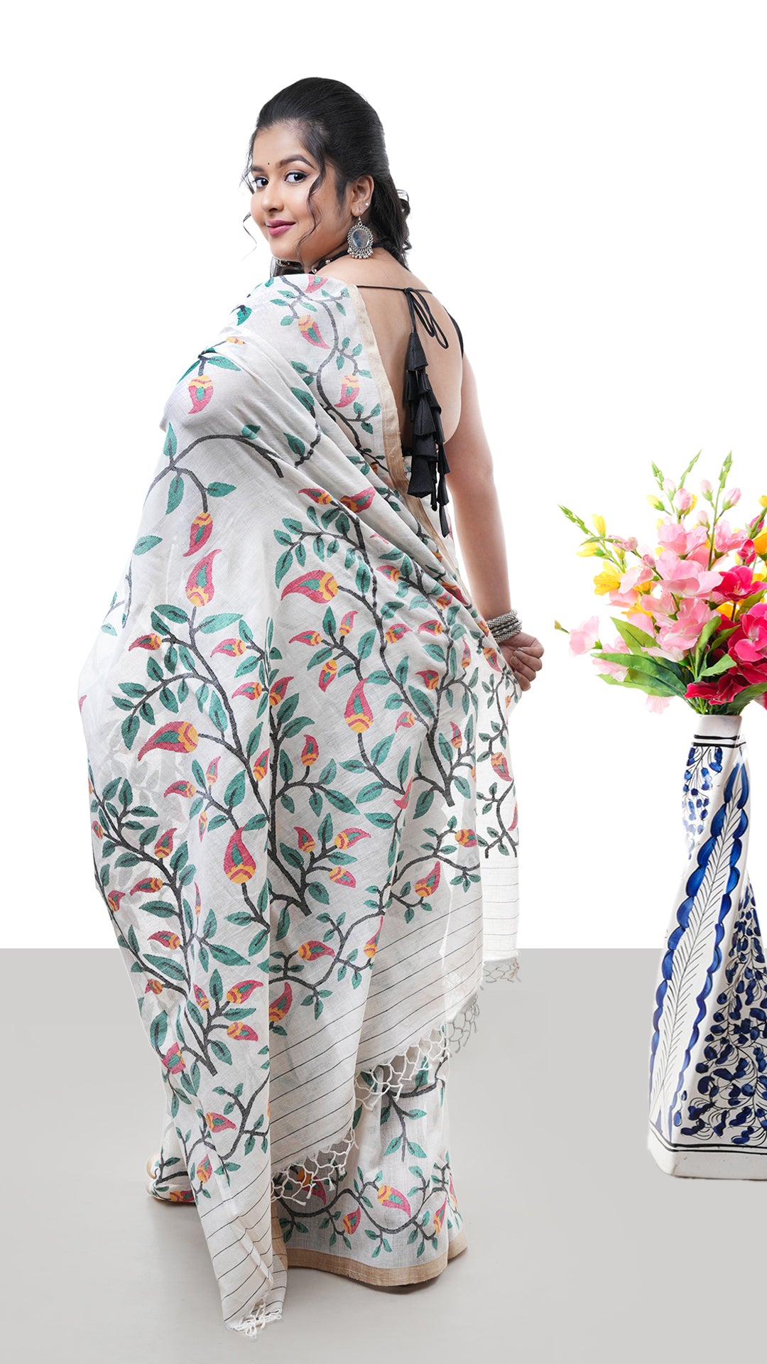 A multi coloured off white saree
