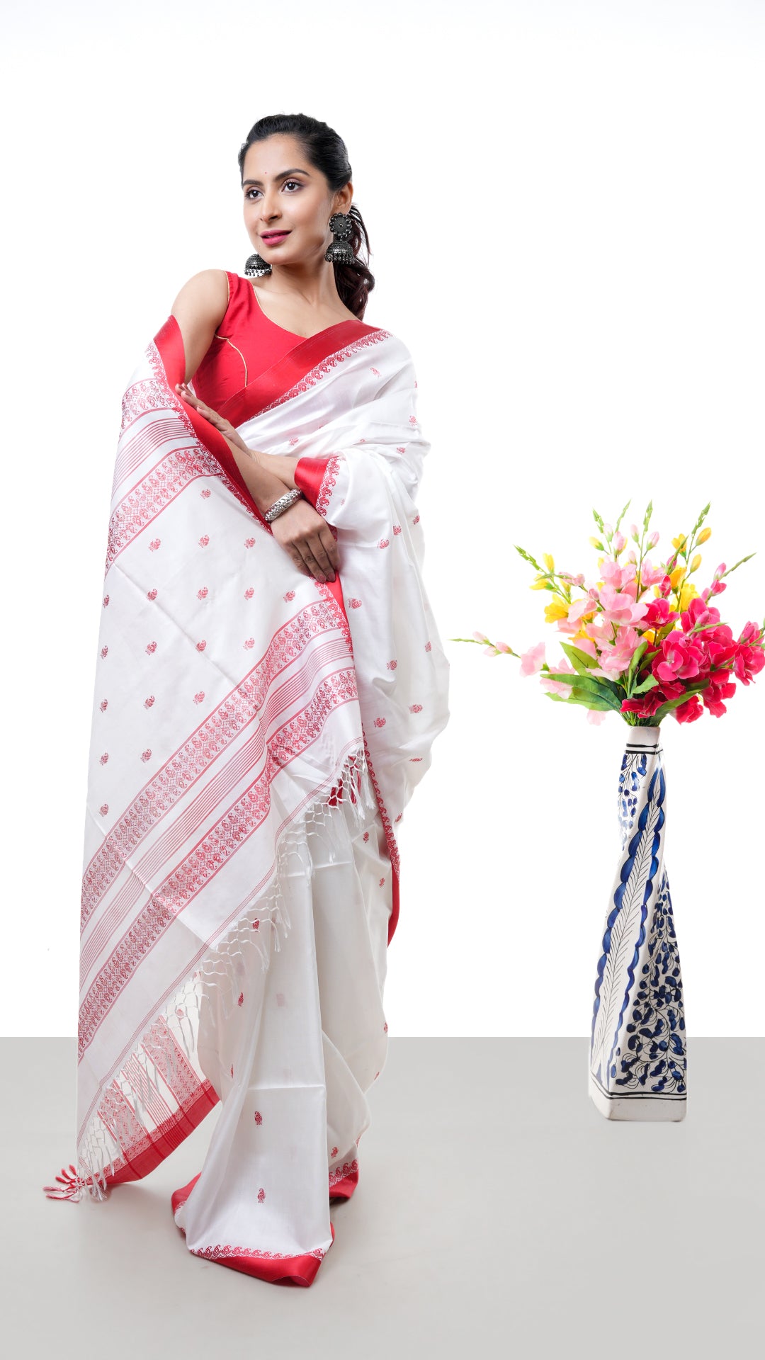An off white red silk saree