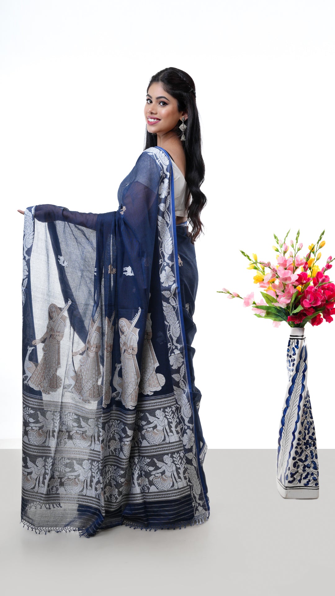 A deep blue baluchari saree