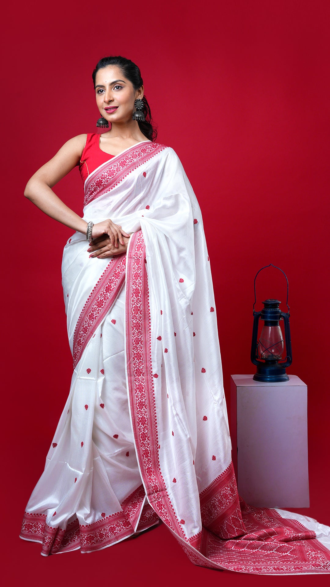 An off white and red silk saree