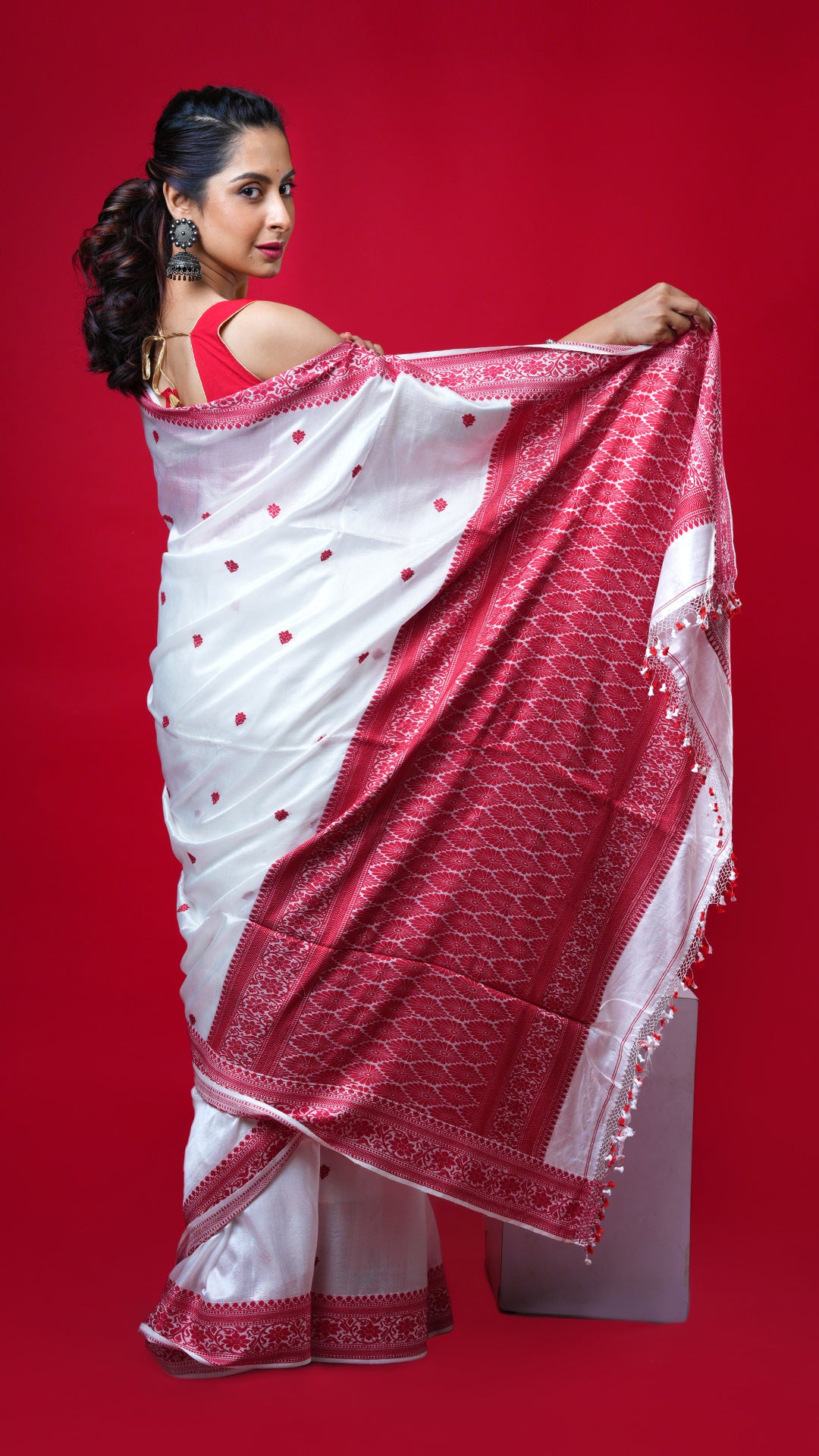 An off white and red silk saree