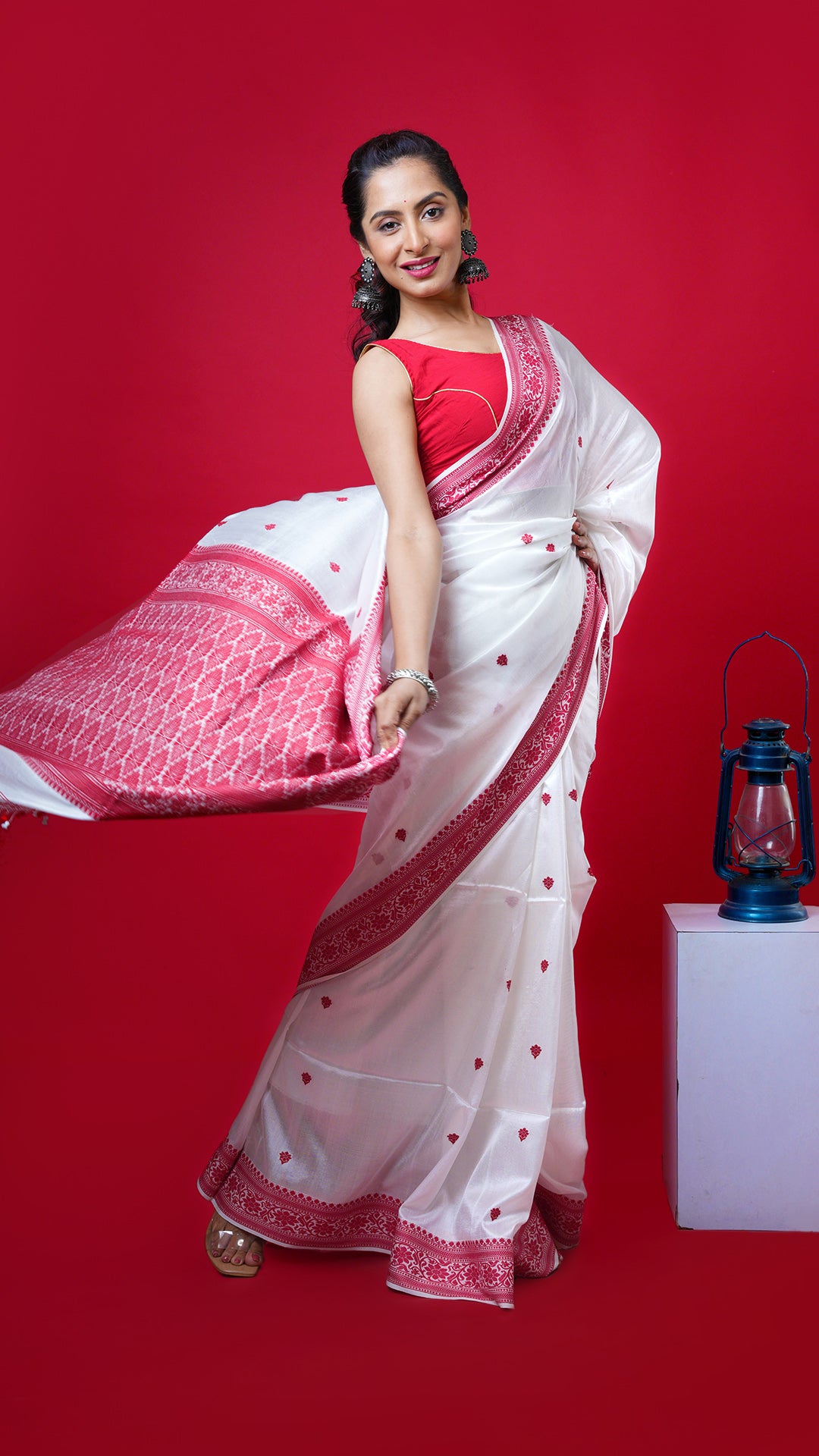 An off white and red silk saree