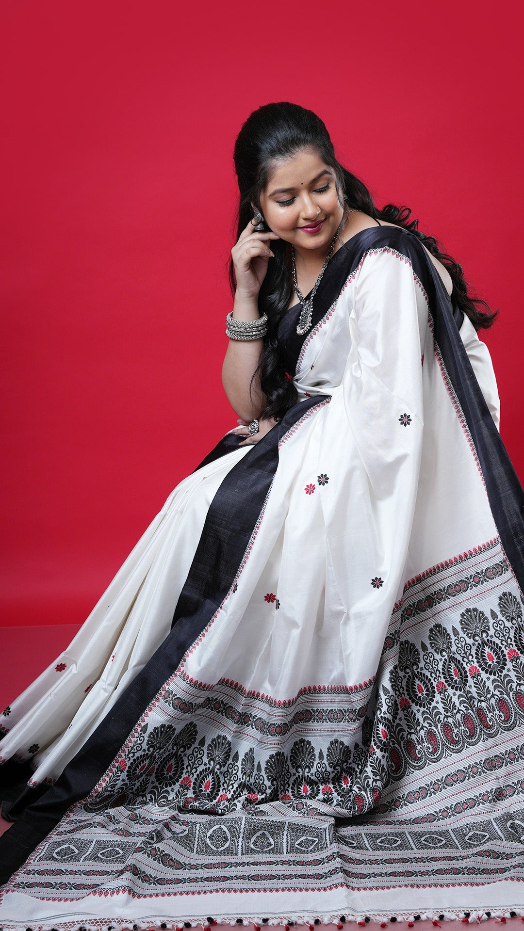 An off white with black and red silk