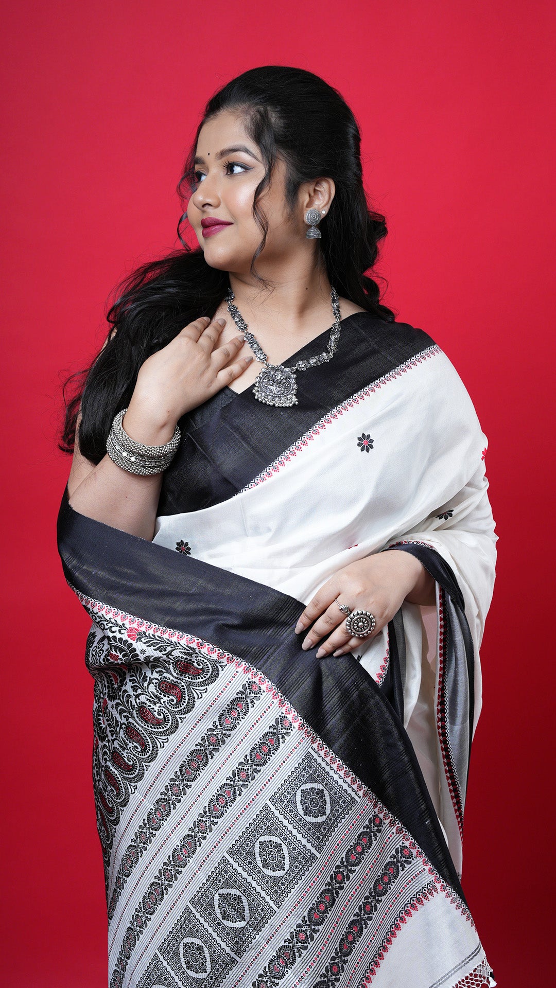 An off white with black and red silk