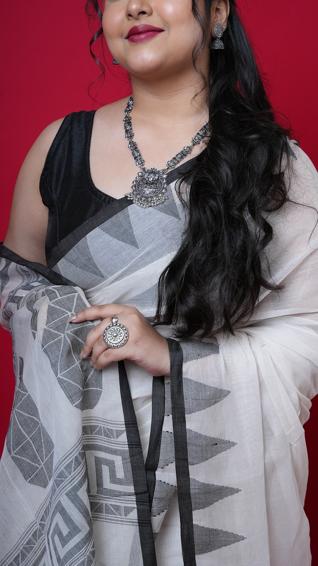An off white and black dhakai saree