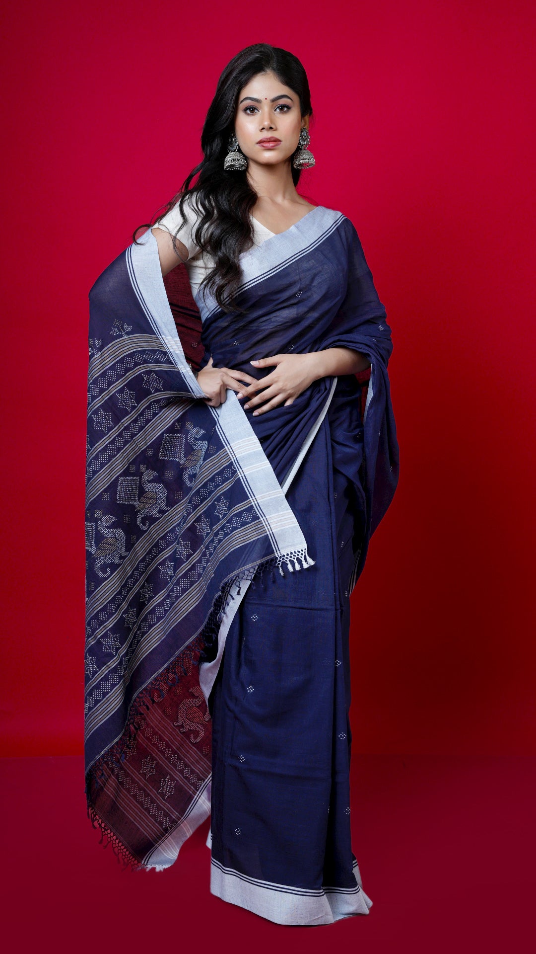 A navy blue tangail saree. A navy blue coloured soft cotton sari. Crafted with soft cotton Warp and weft. Standard 5.5-meter length. Includes matching blouse piece. Tangail saree, cotton saree