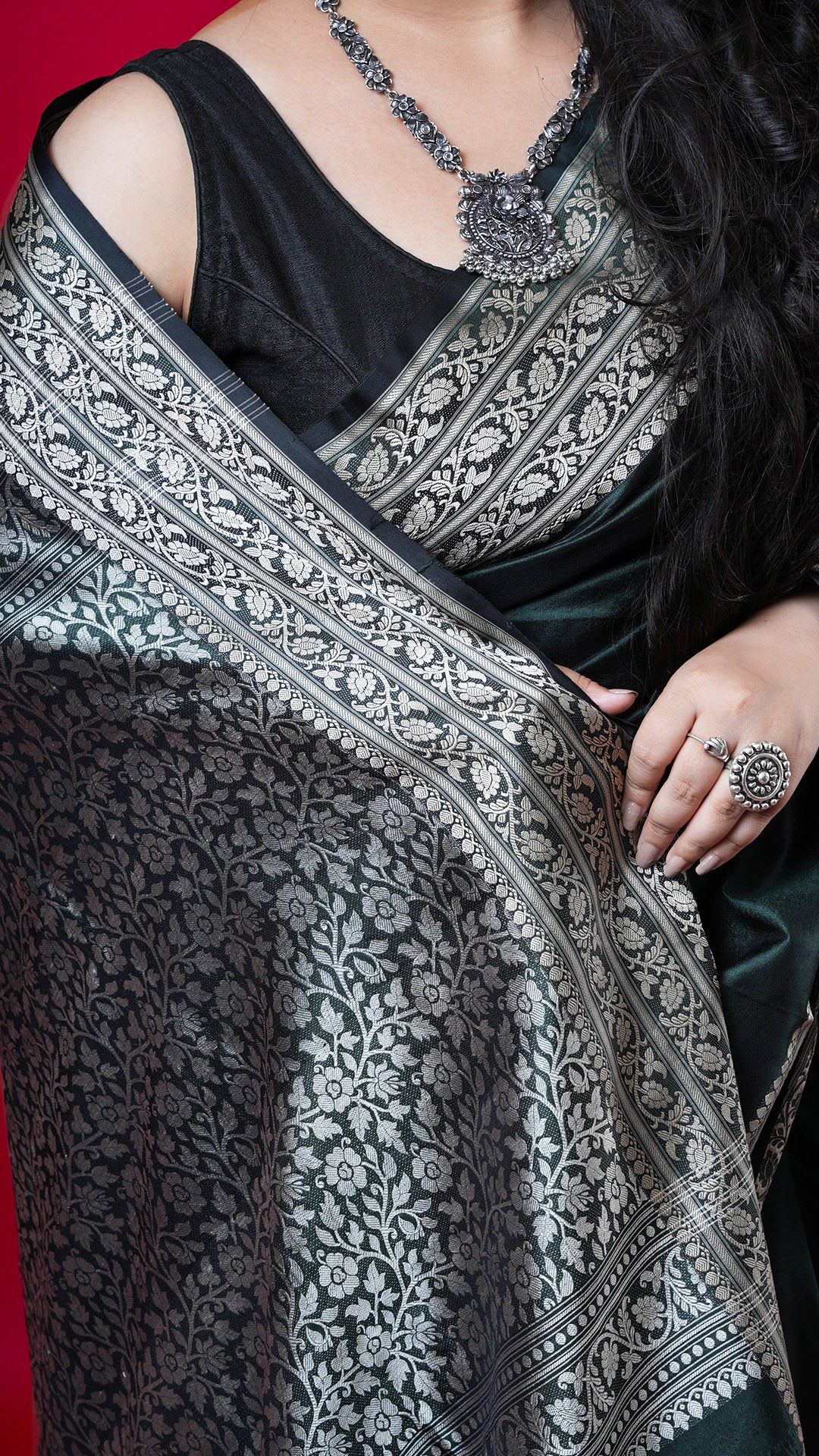 A bottle green coloured silk saree