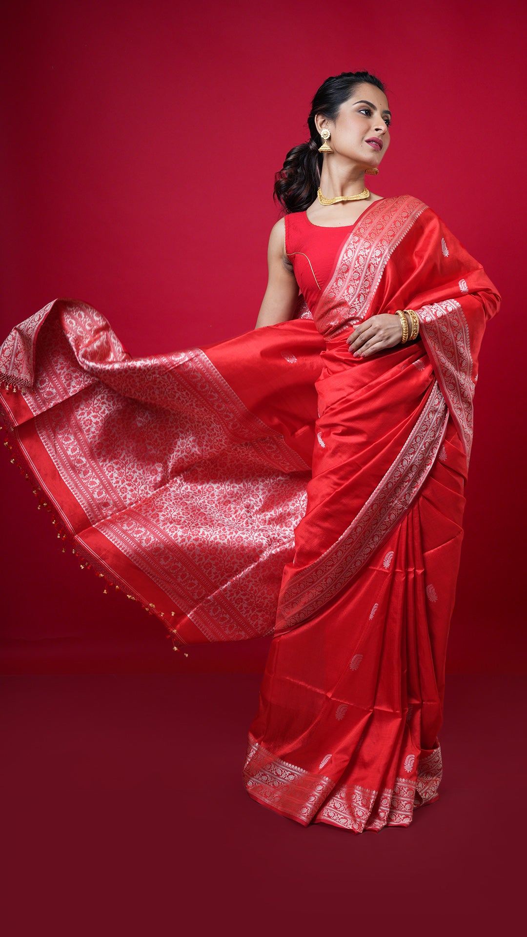 A red coloured silk saree