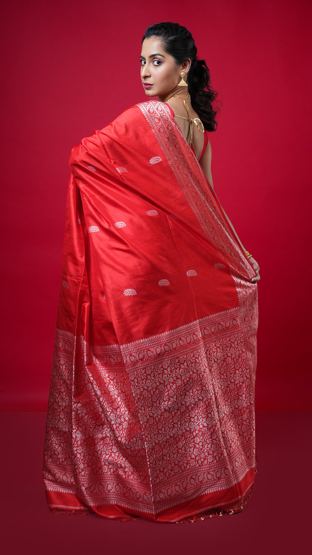 A red coloured silk saree