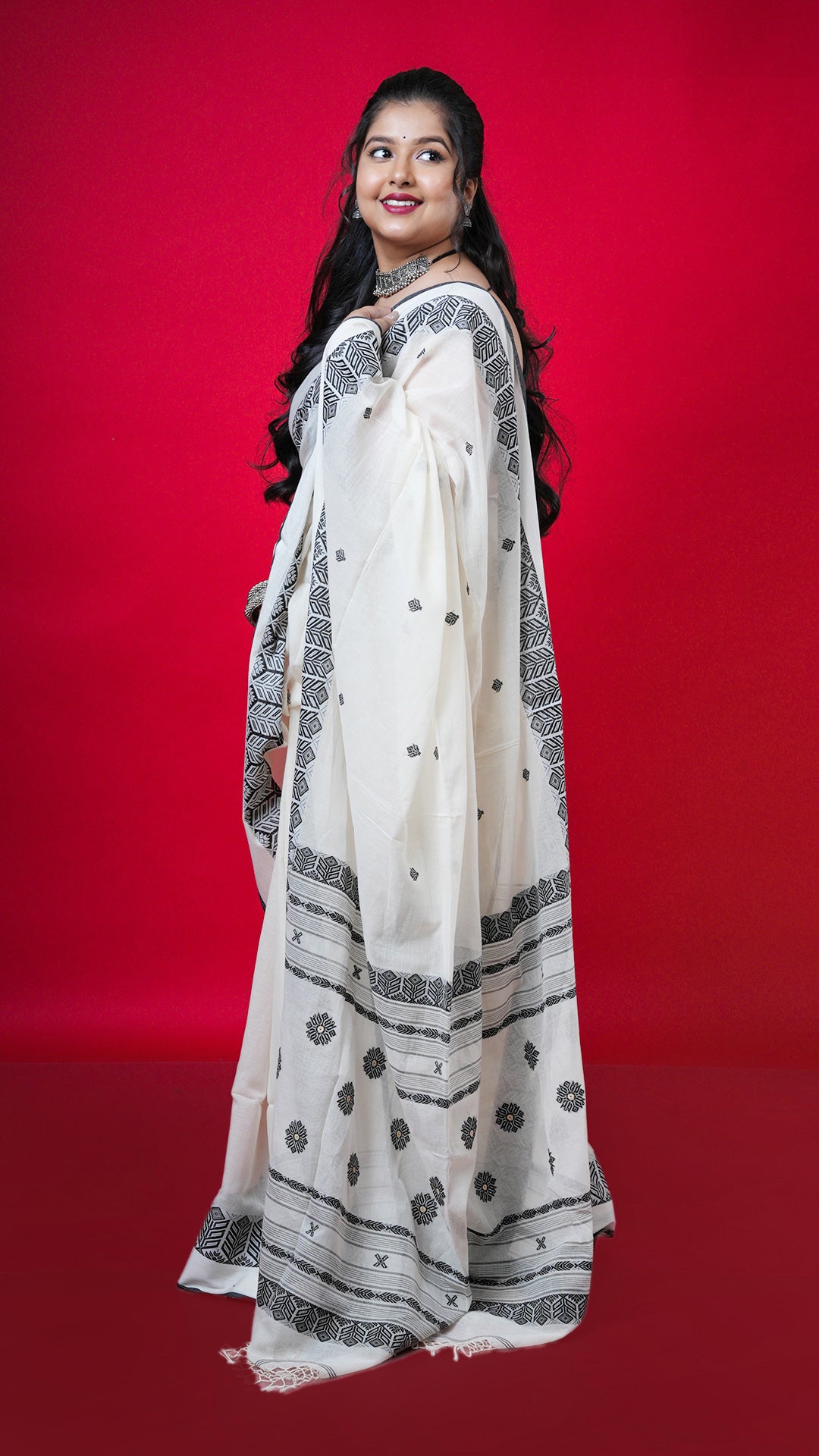 A off white and black tangail saree