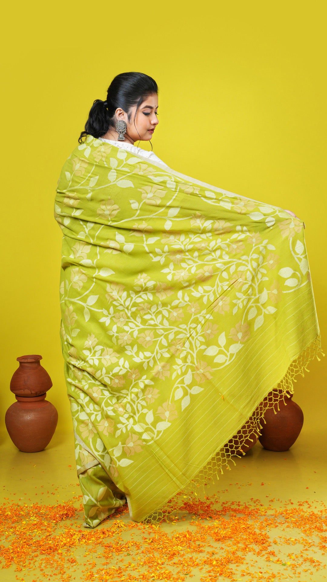 A green coloured dhakai saree