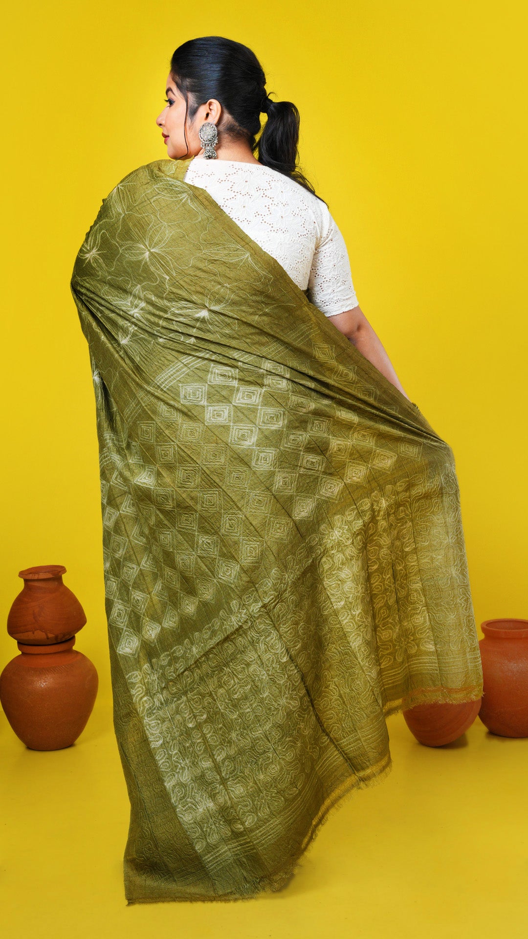 A mehendi green shibori saree