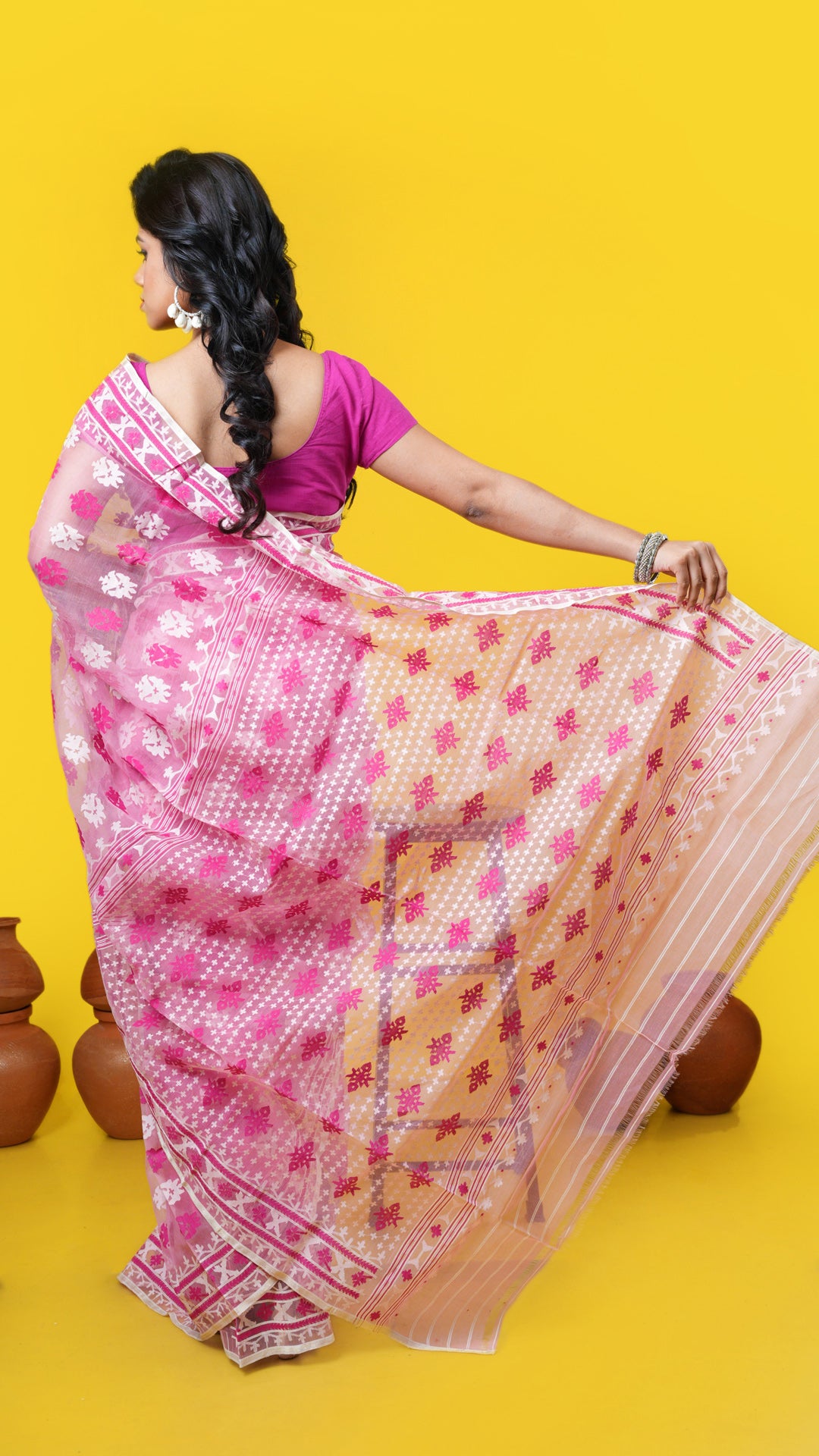 A light pink jamdani saree