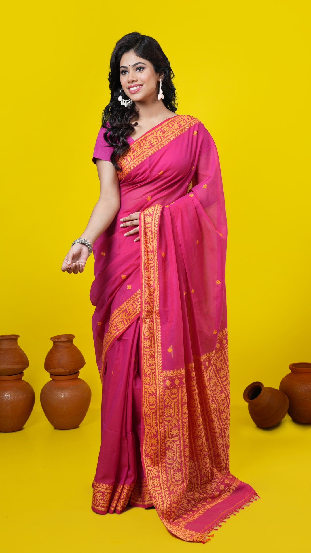 A pinkish red dual tone tangail saree