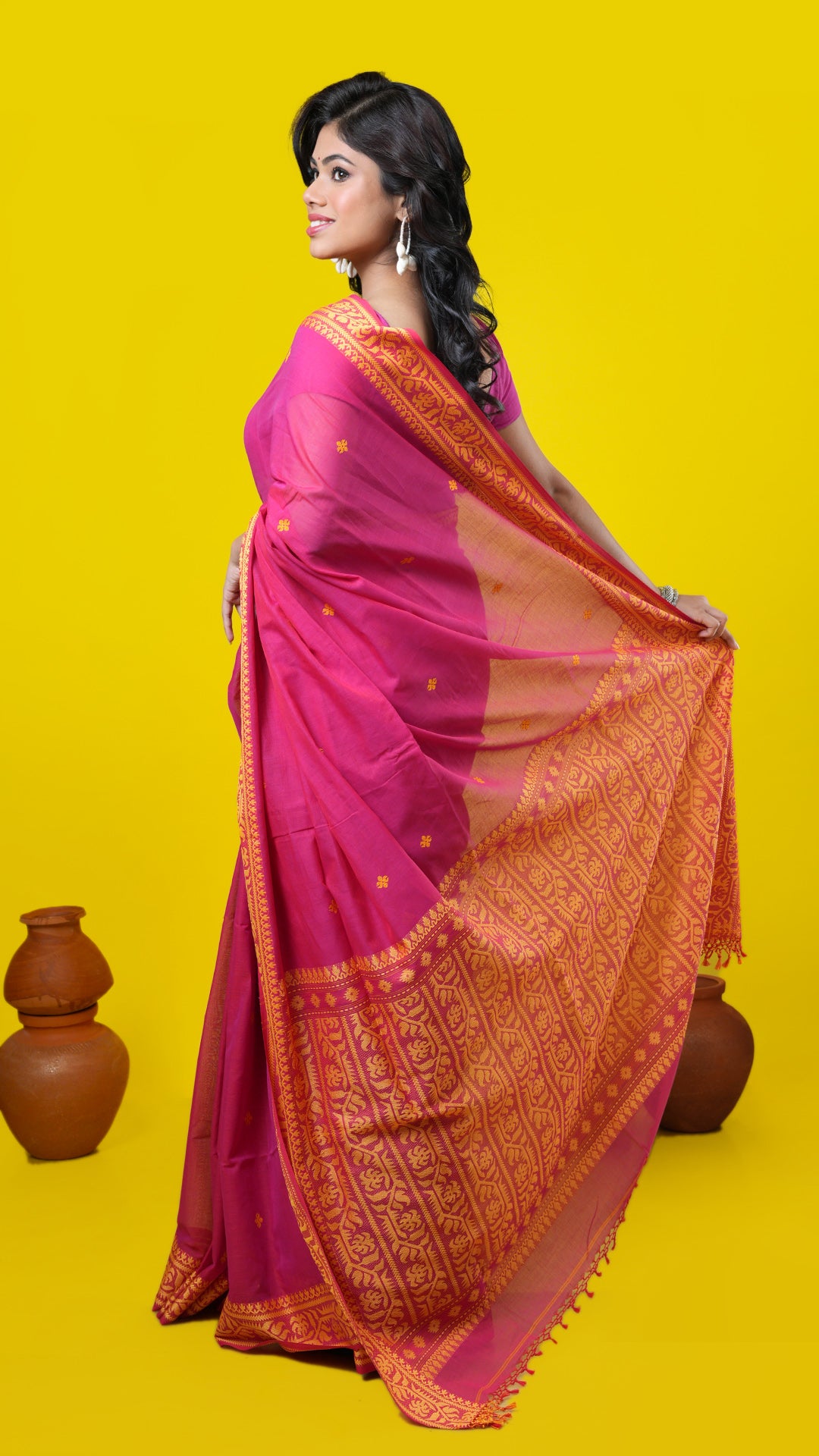 A pinkish red dual tone tangail saree
