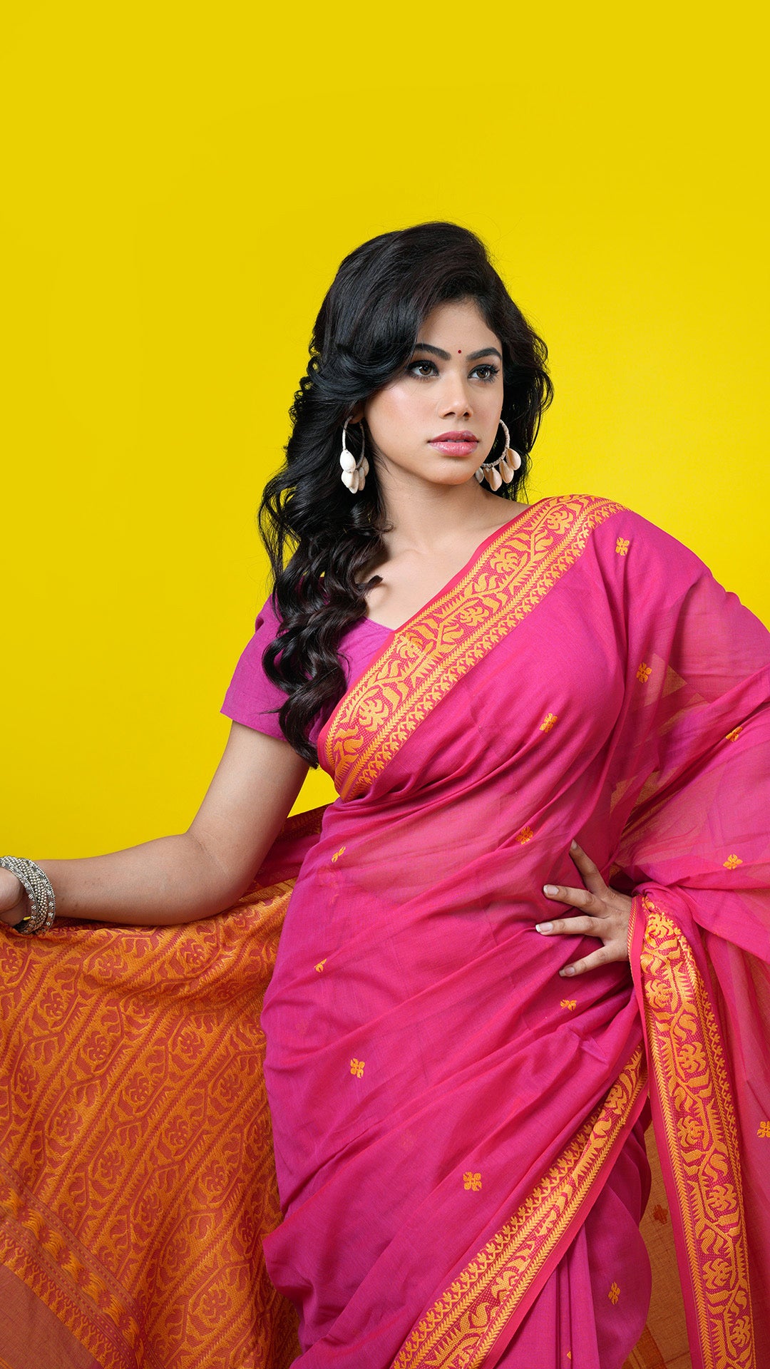 A pinkish red dual tone tangail saree