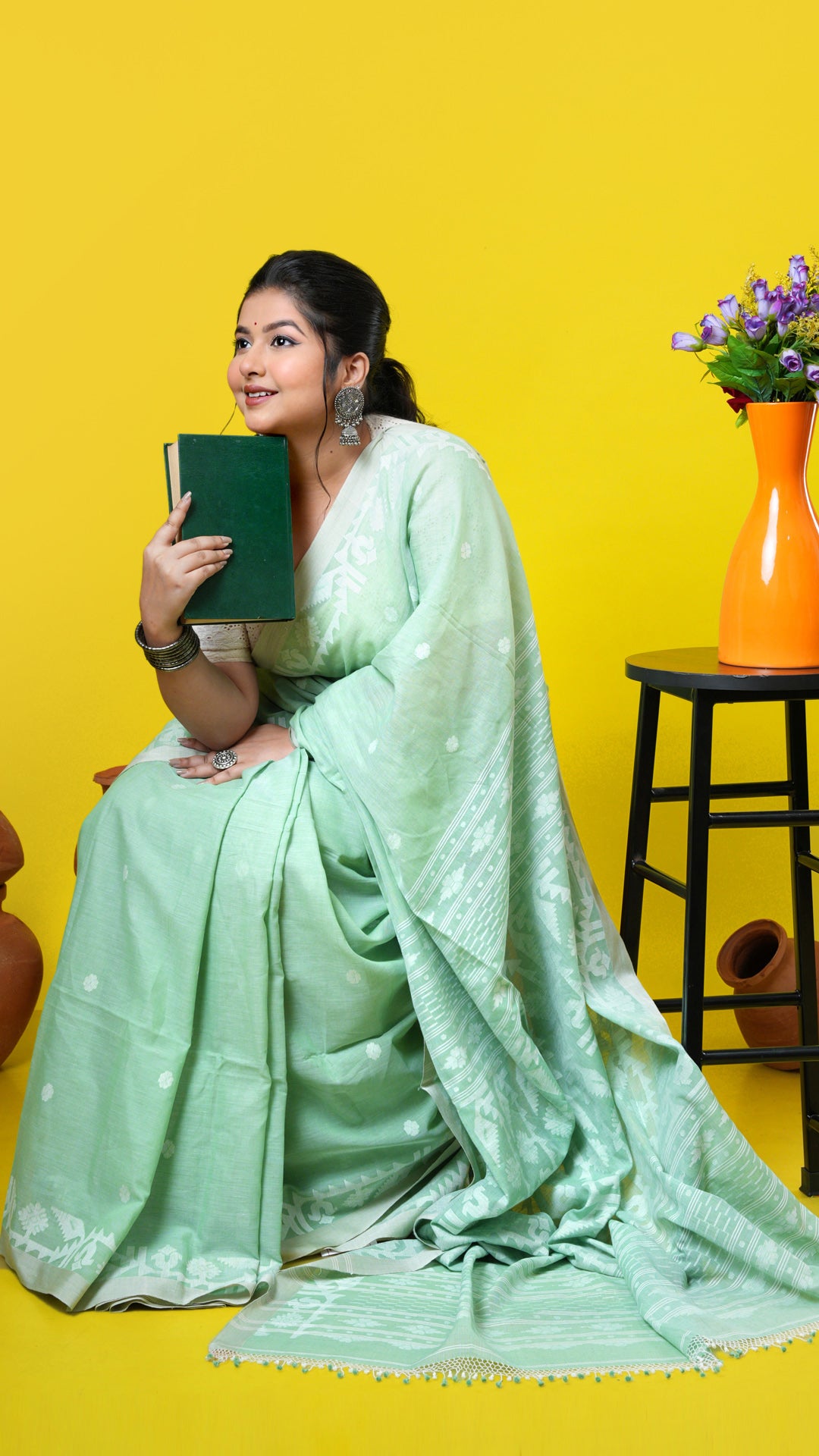 A light green coloured dhakai saree, made of Soft cotton Warp and Soft cotton weft. Perfect for traditional, party wear, wedding, gifts, this saree includes has blouse piece, 0.80 mts, running. Price: Rs. 9500/-. Category: Tant, dhakai.