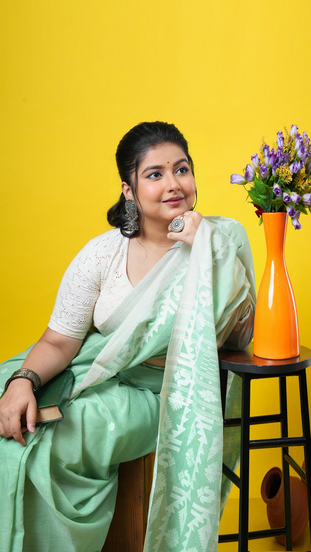 A light green coloured dhakai saree