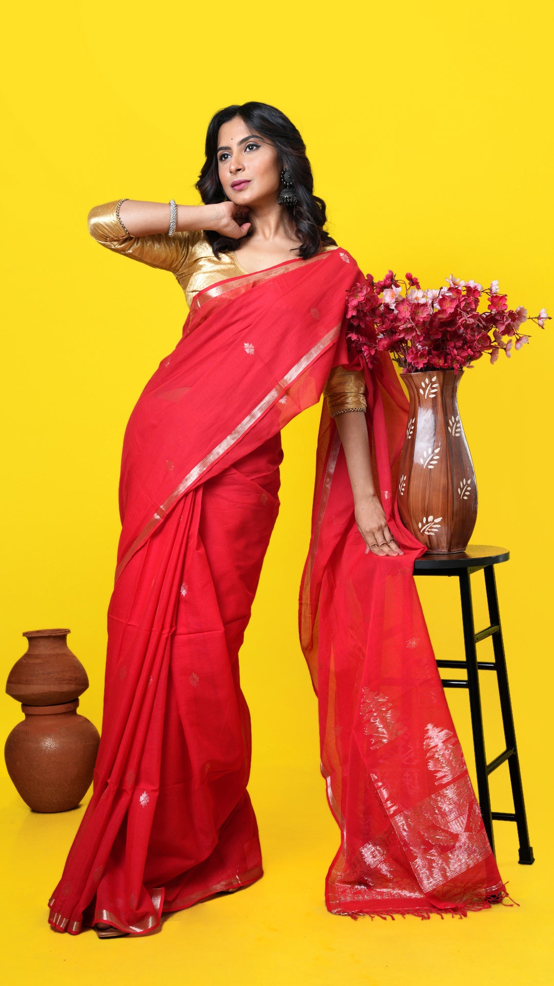 Red soft cotton Tangail saree with golden zari woven border, butis, and pallu. Price: Rs. 2,500/-