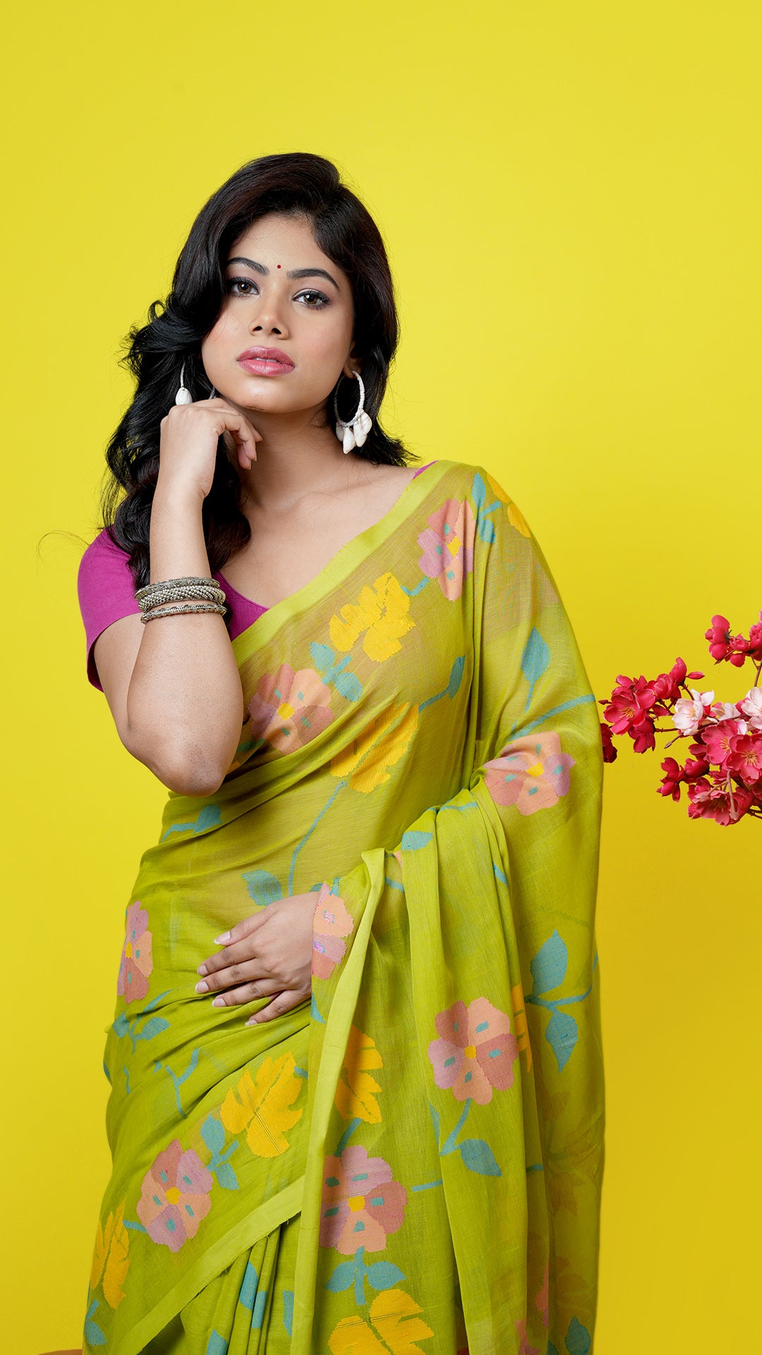 A bright green coloured dhakai saree
