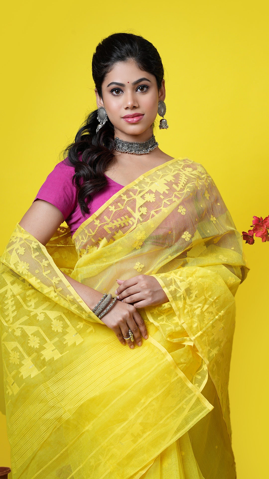 A yellow coloured jamdani saree