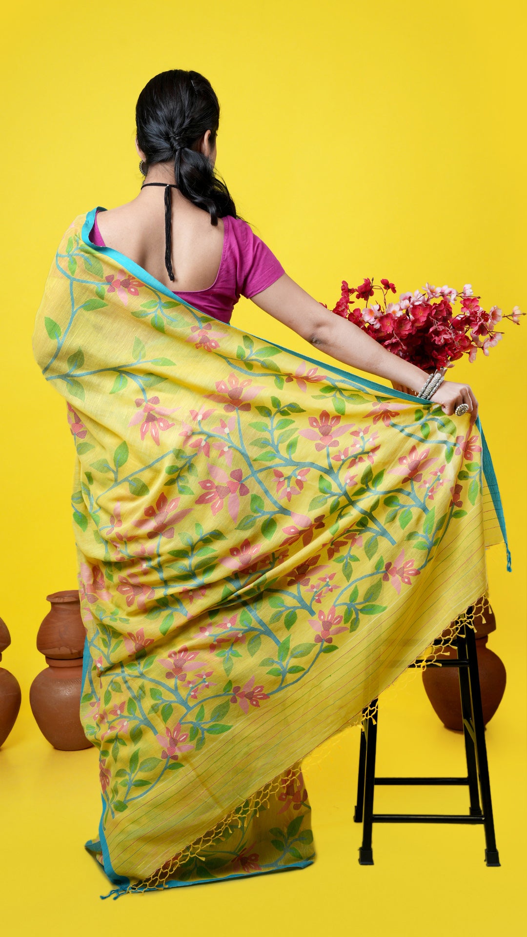 A yellow dhakai saree