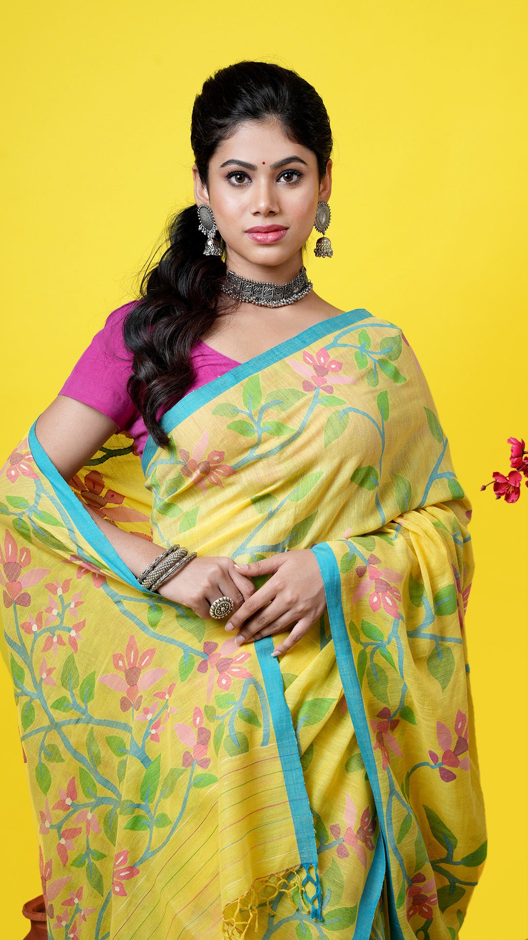 A yellow dhakai saree