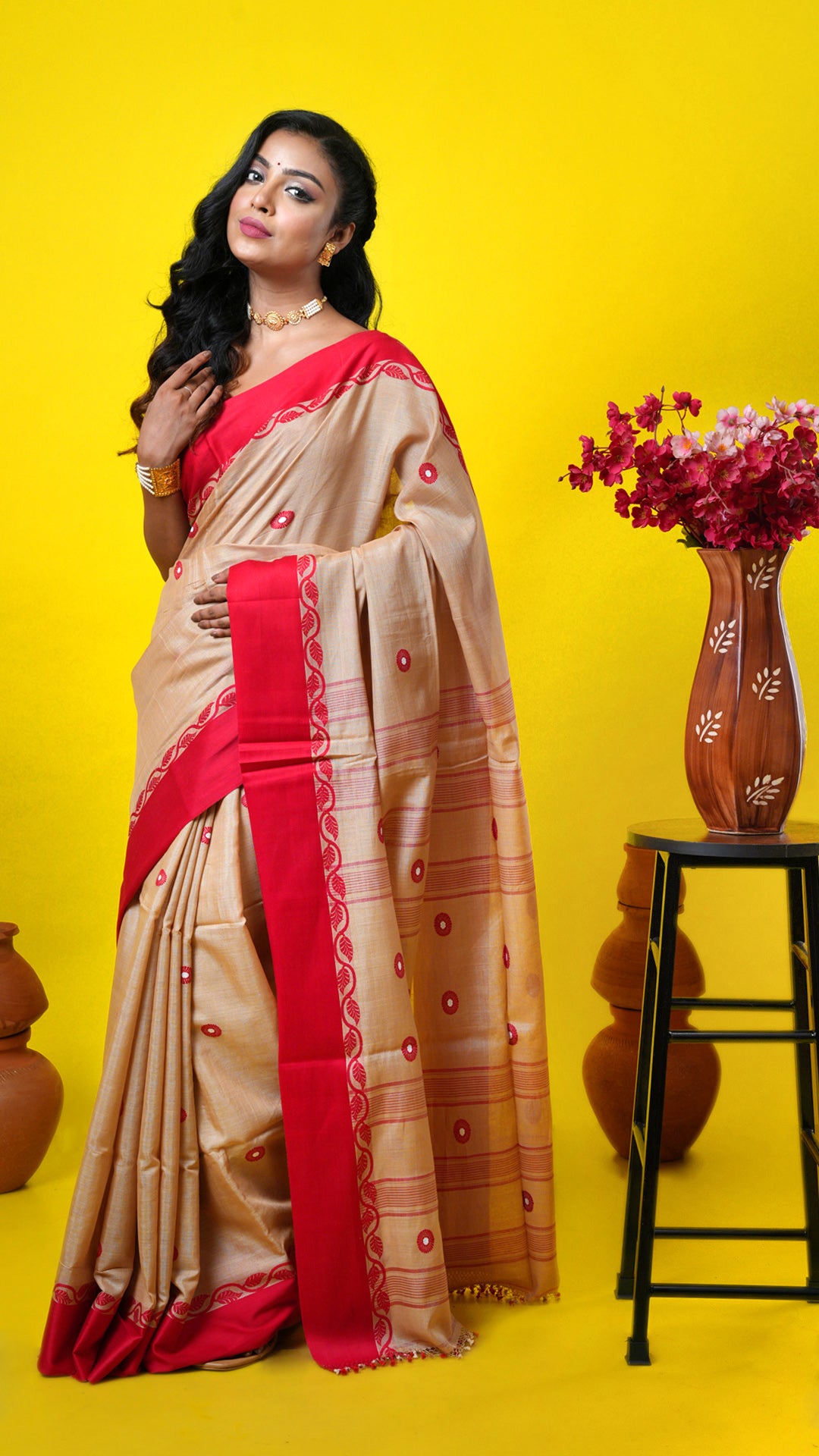Natural Tassar saree with red woven border, red and off-white butis and pallu. Price: Rs. 12000/-