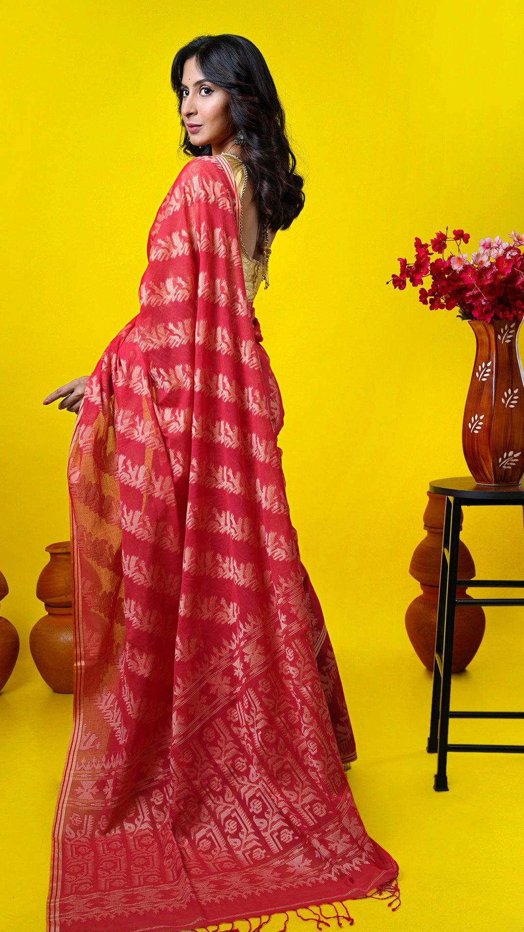A red all over woven saree