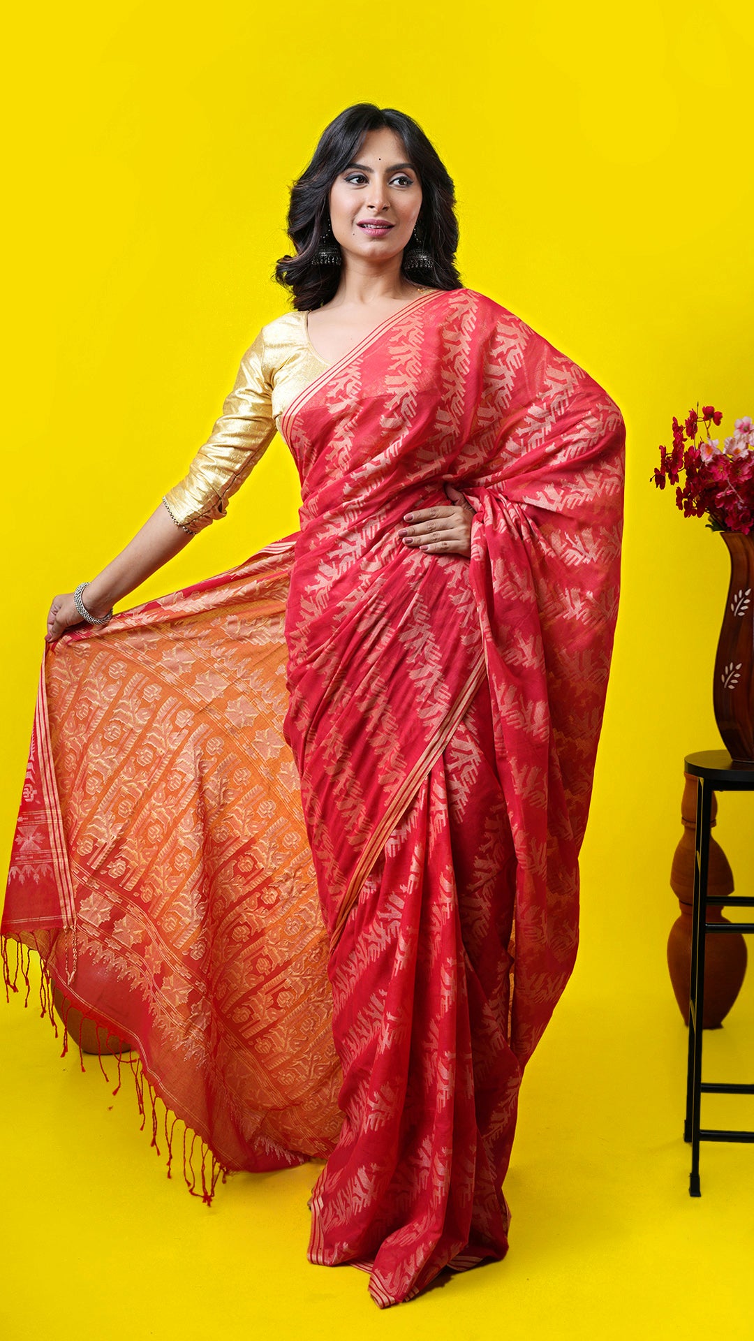 A red all over woven saree