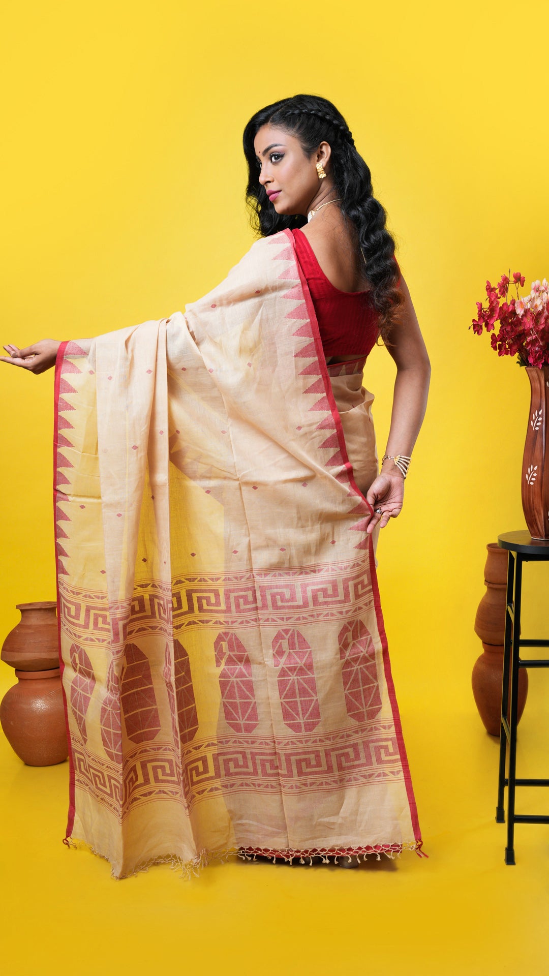 A beize temple border saree