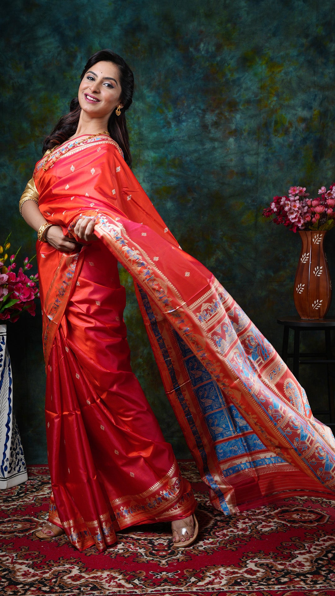 A flame coloured baluchari saree