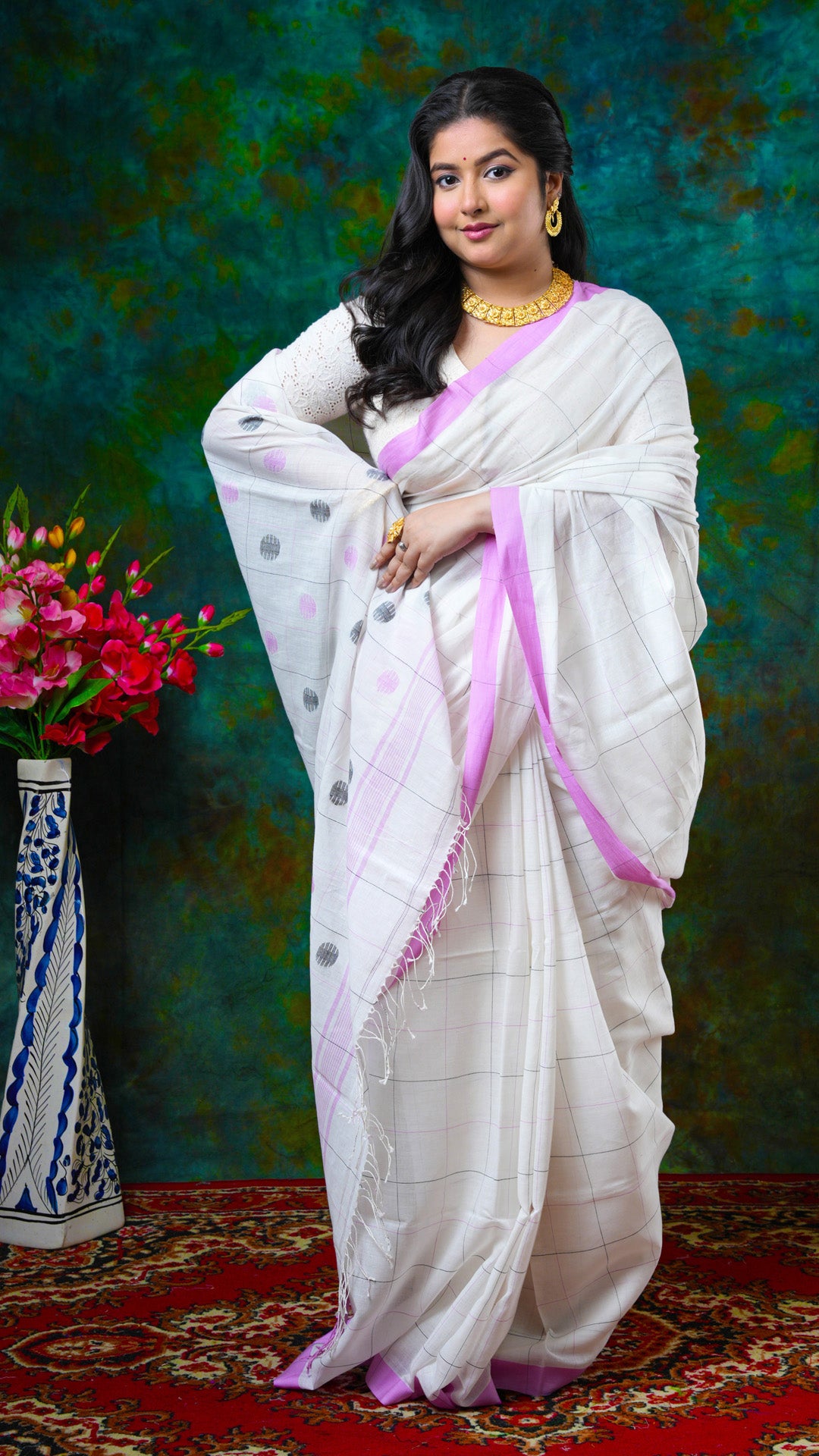 An off white check design saree