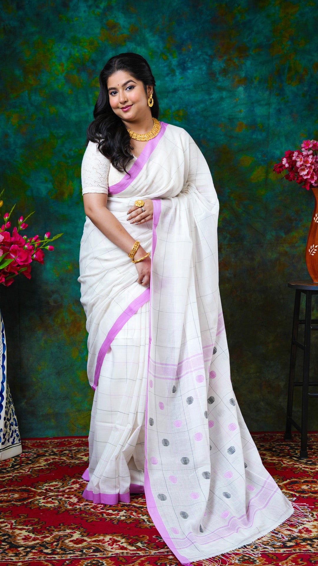 An off white check design saree