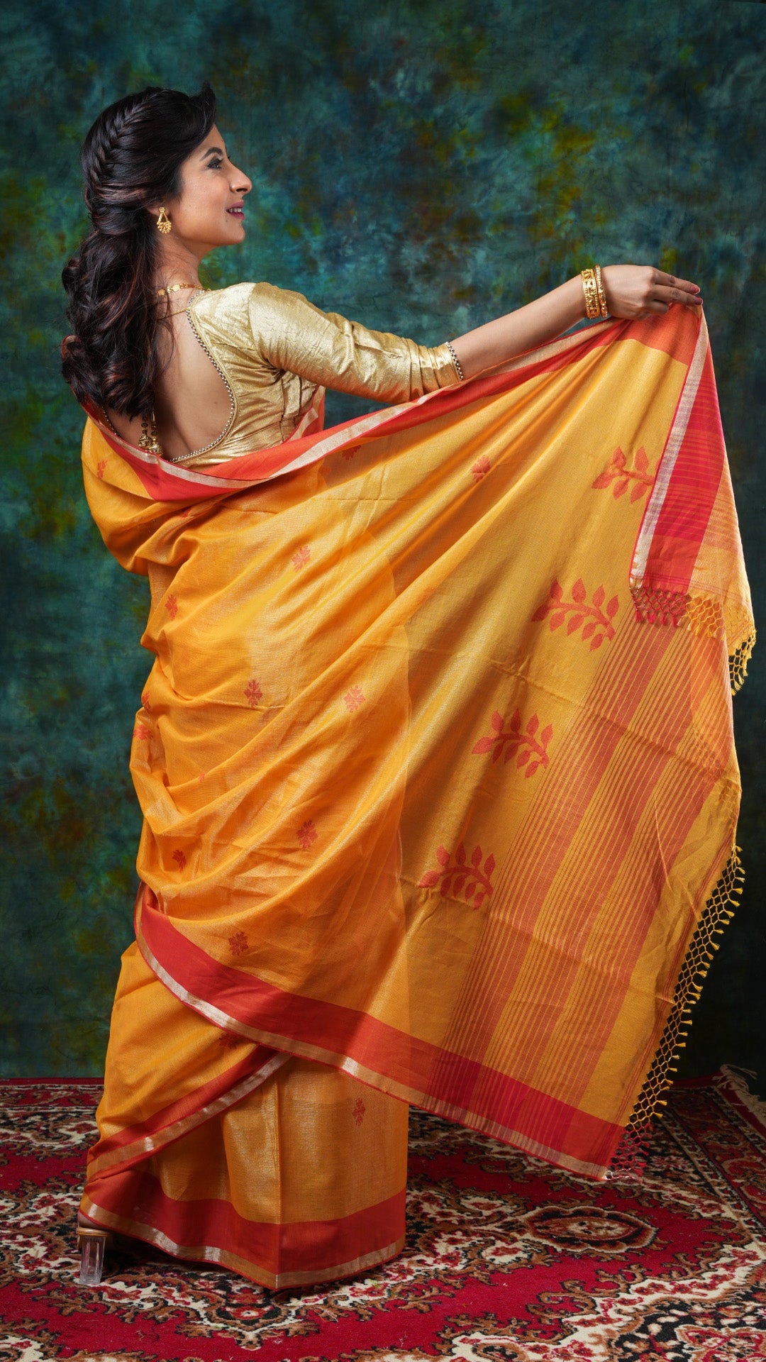 A golden yellow tissue saree